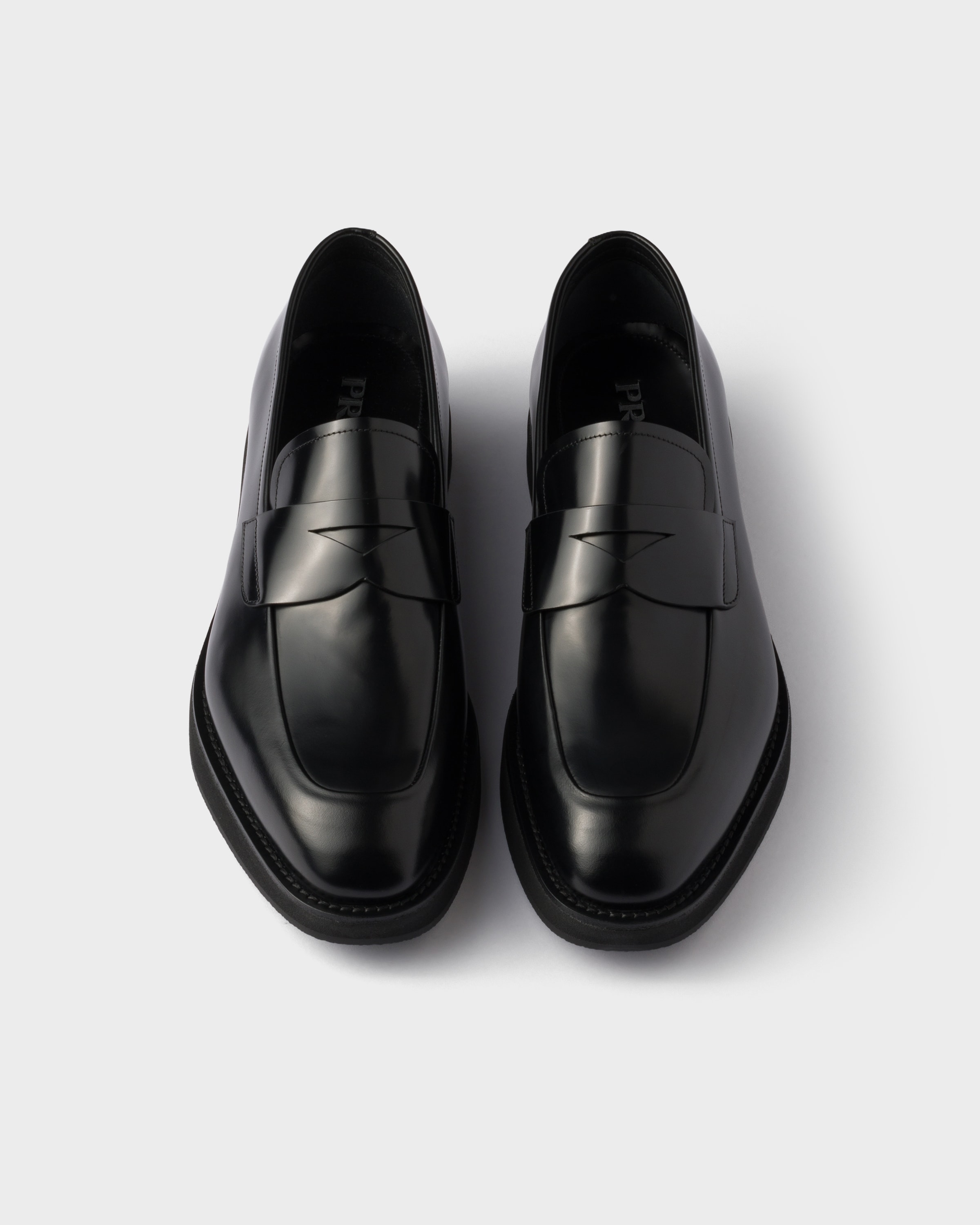 ブラック ブラッシュドレザーローファー | PRADA - 日本