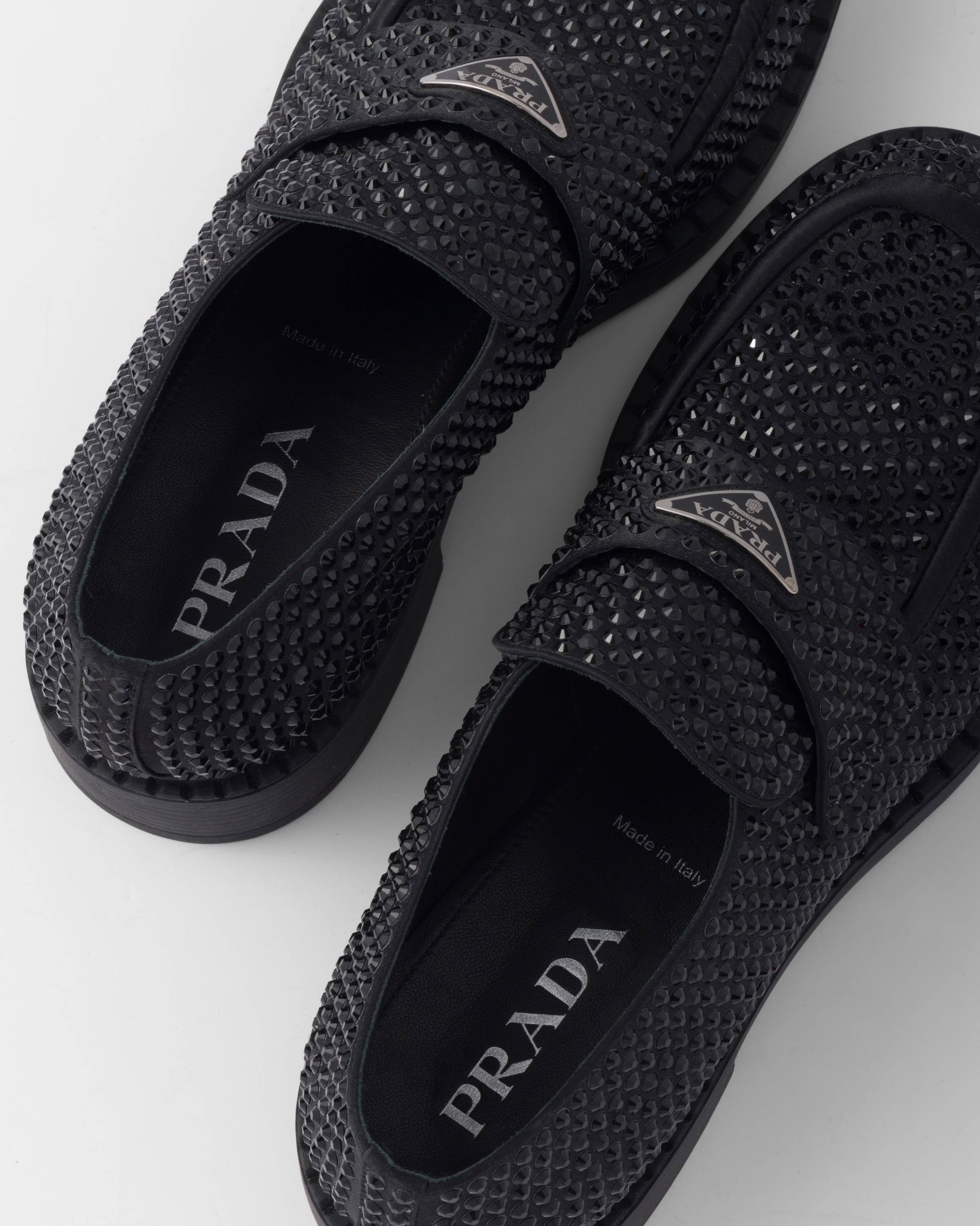 black perforated slip on
