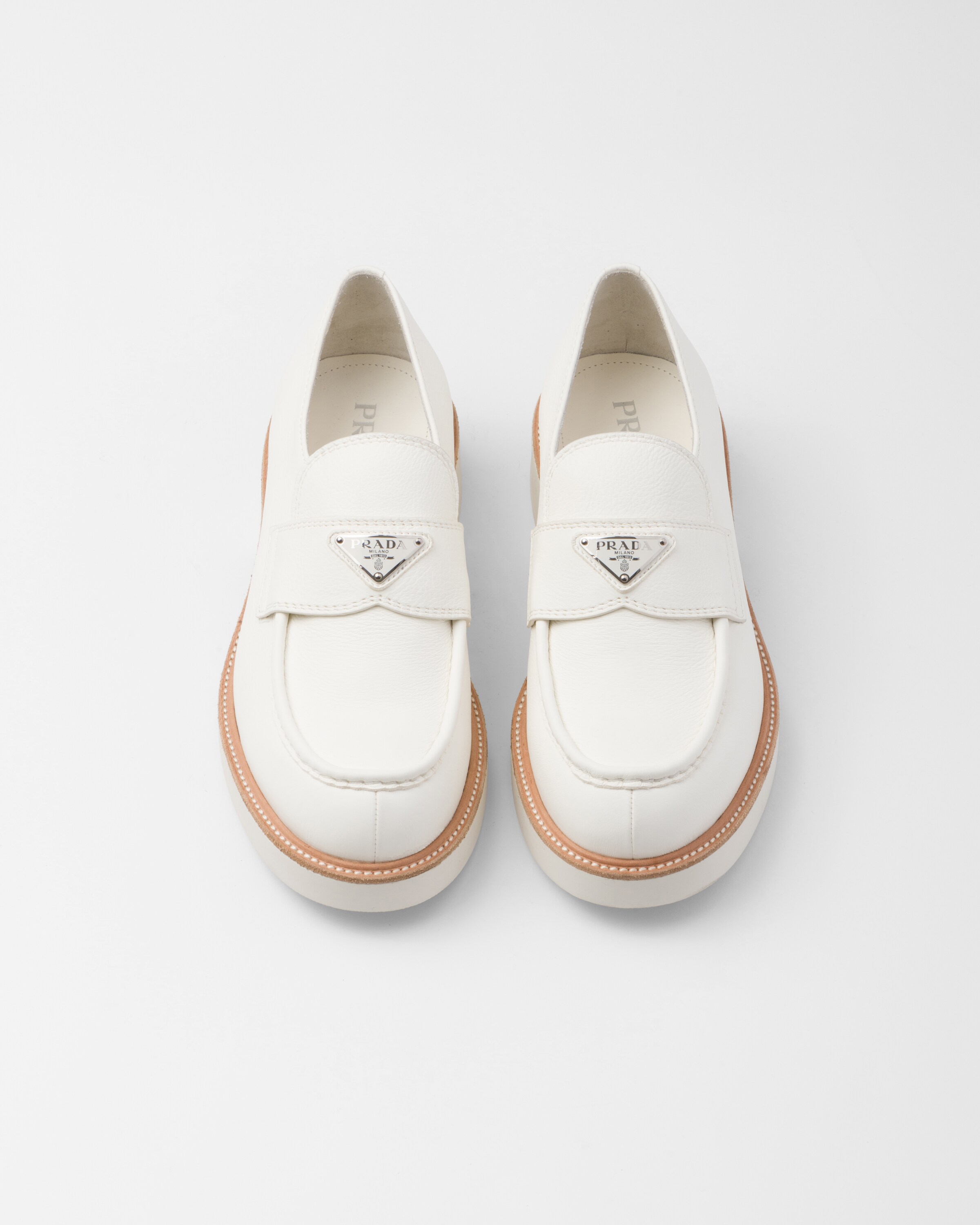 Shop Prada Leather Loafers In Ivory