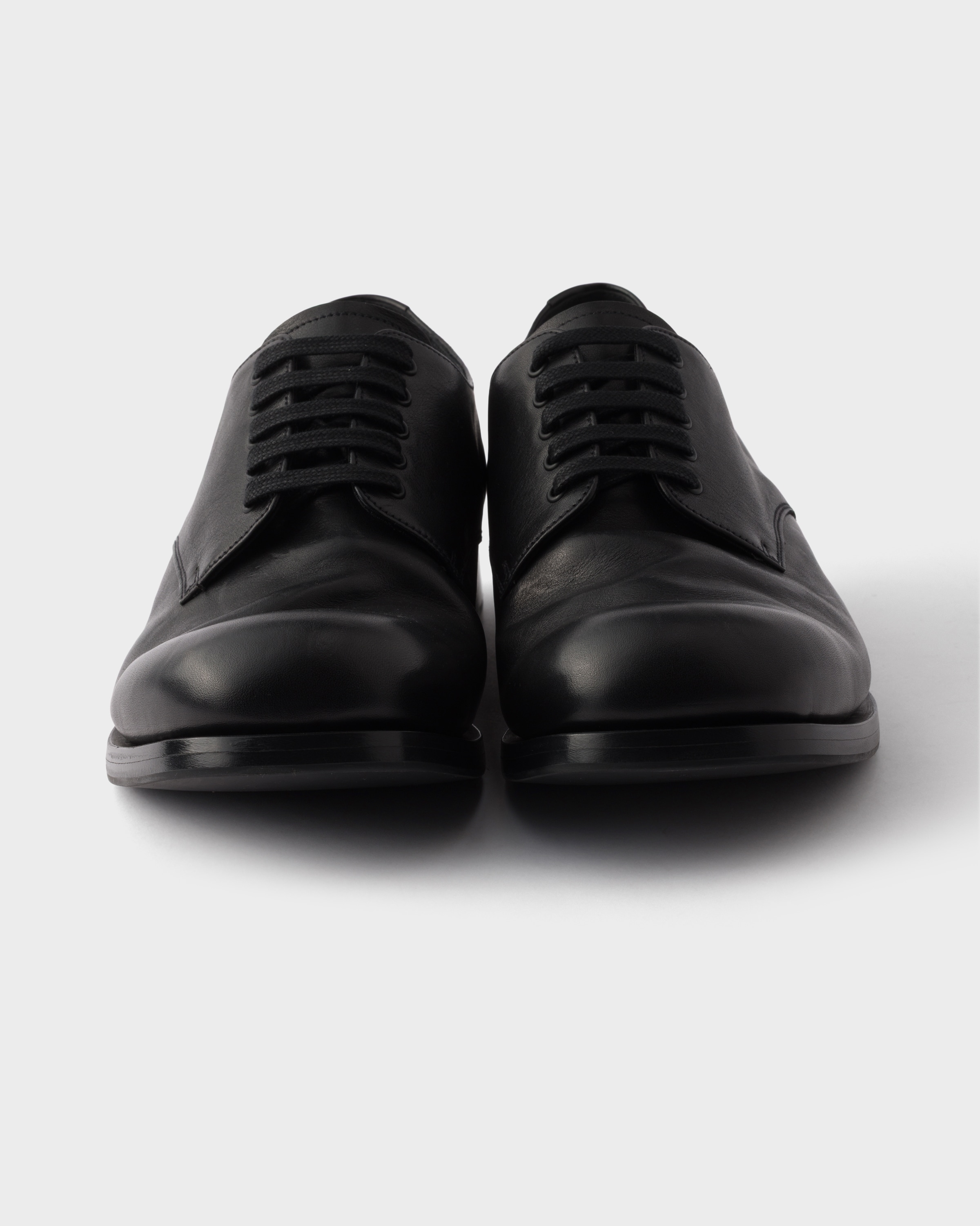 Black Antiqued leather laced derby shoes | PRADA - United States