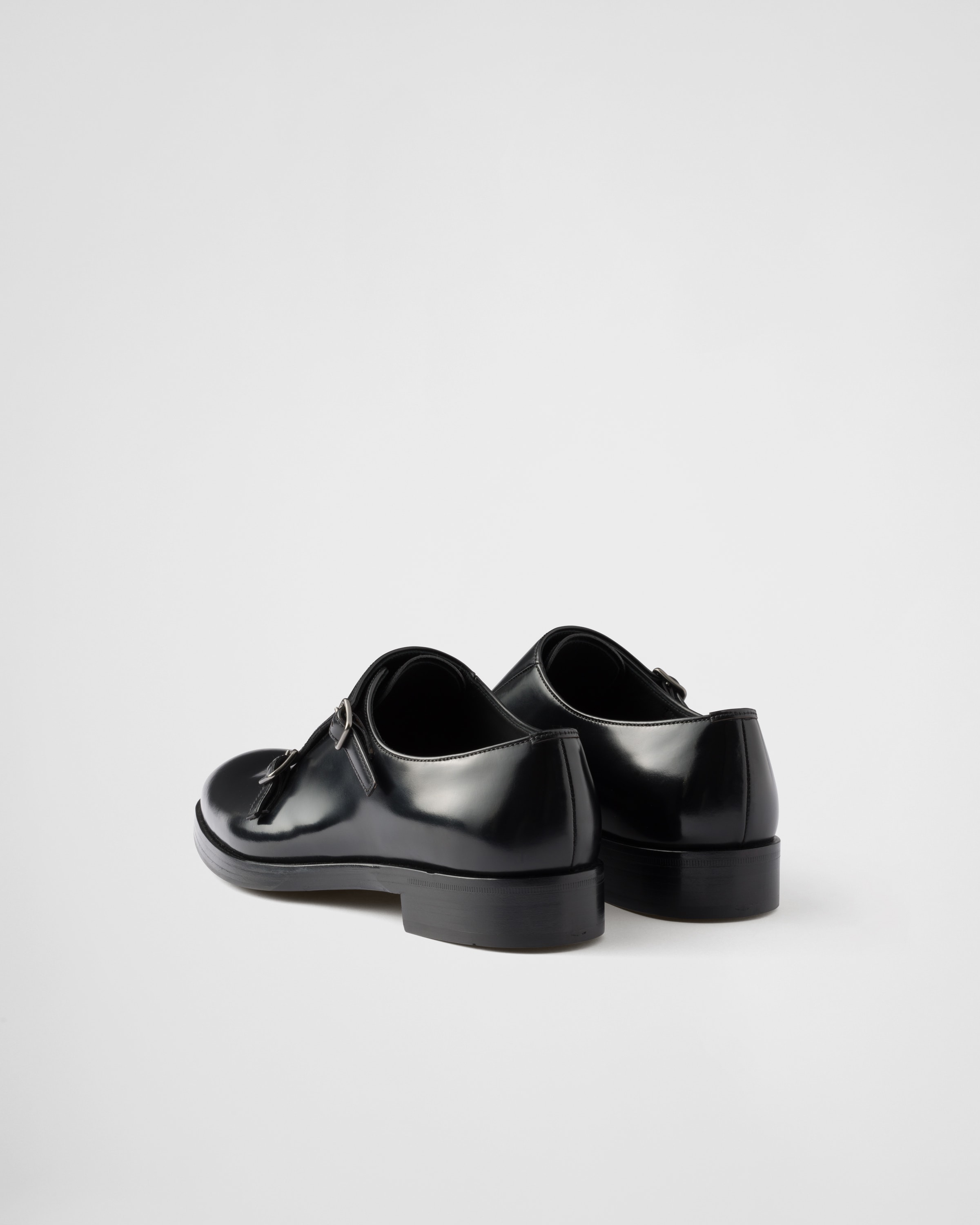 Black Brushed leather double monk strap shoes | PRADA