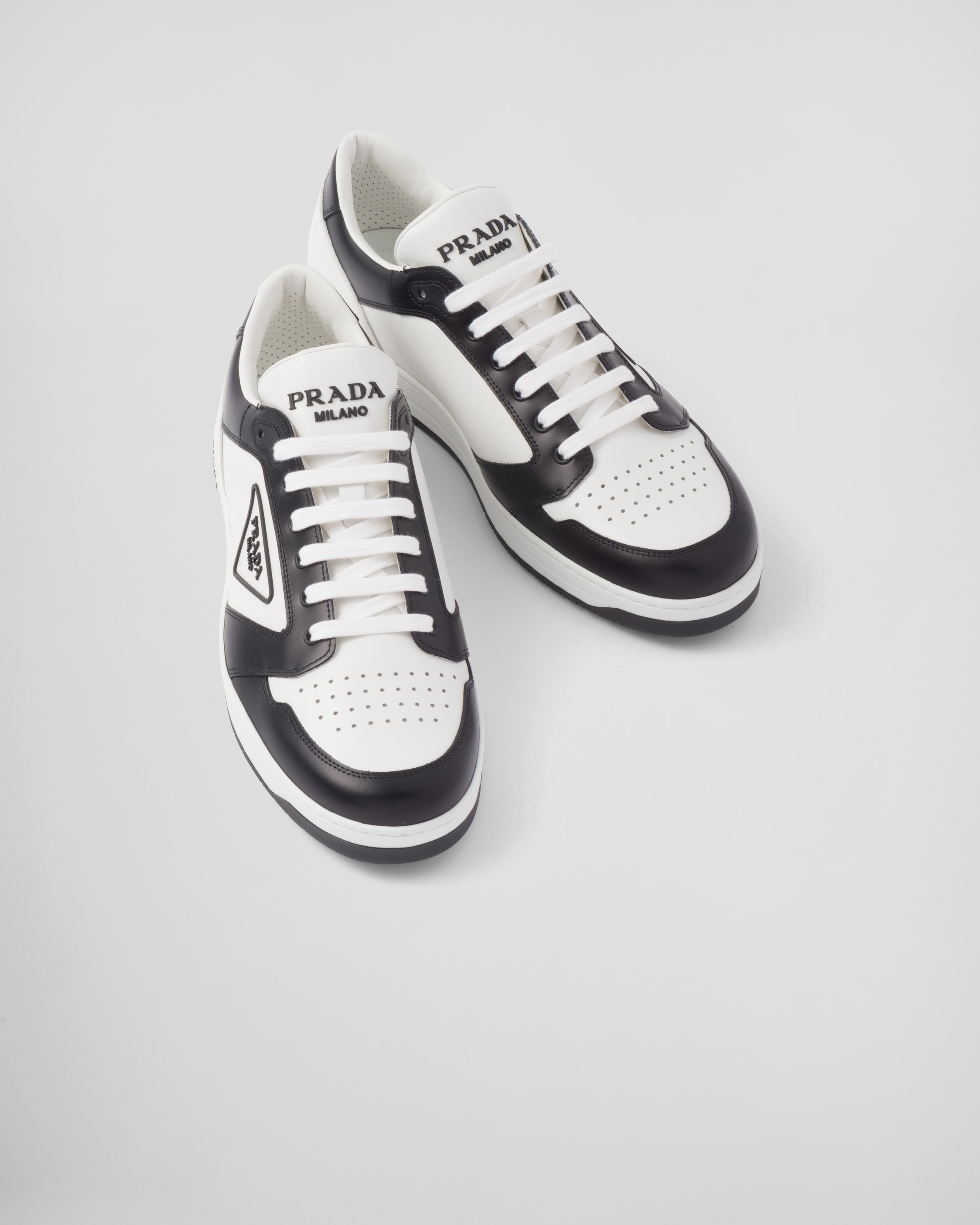 White/black District leather sneakers | Prada