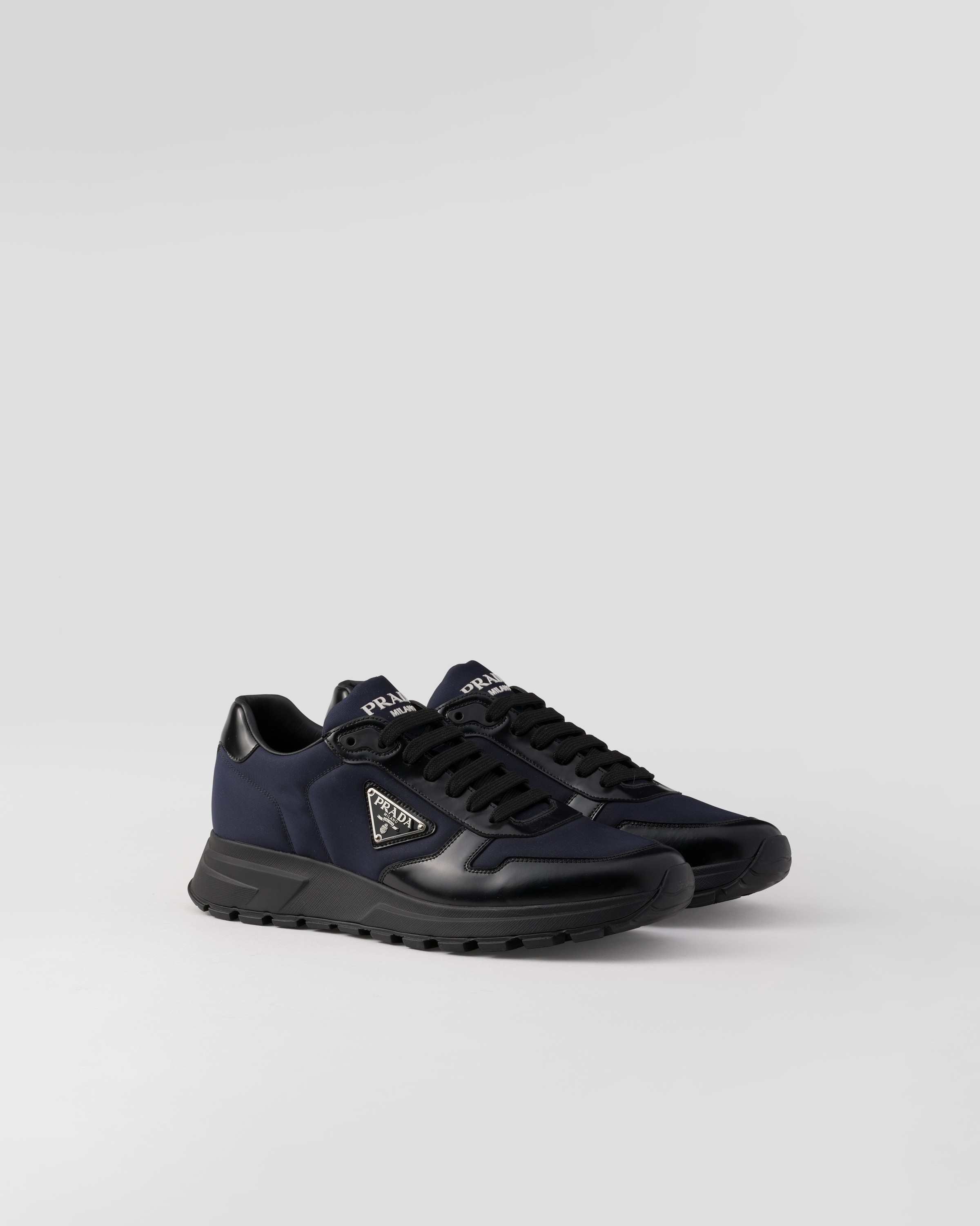 Prada Re-nylon And Brushed Leather Sneakers In Blue/black