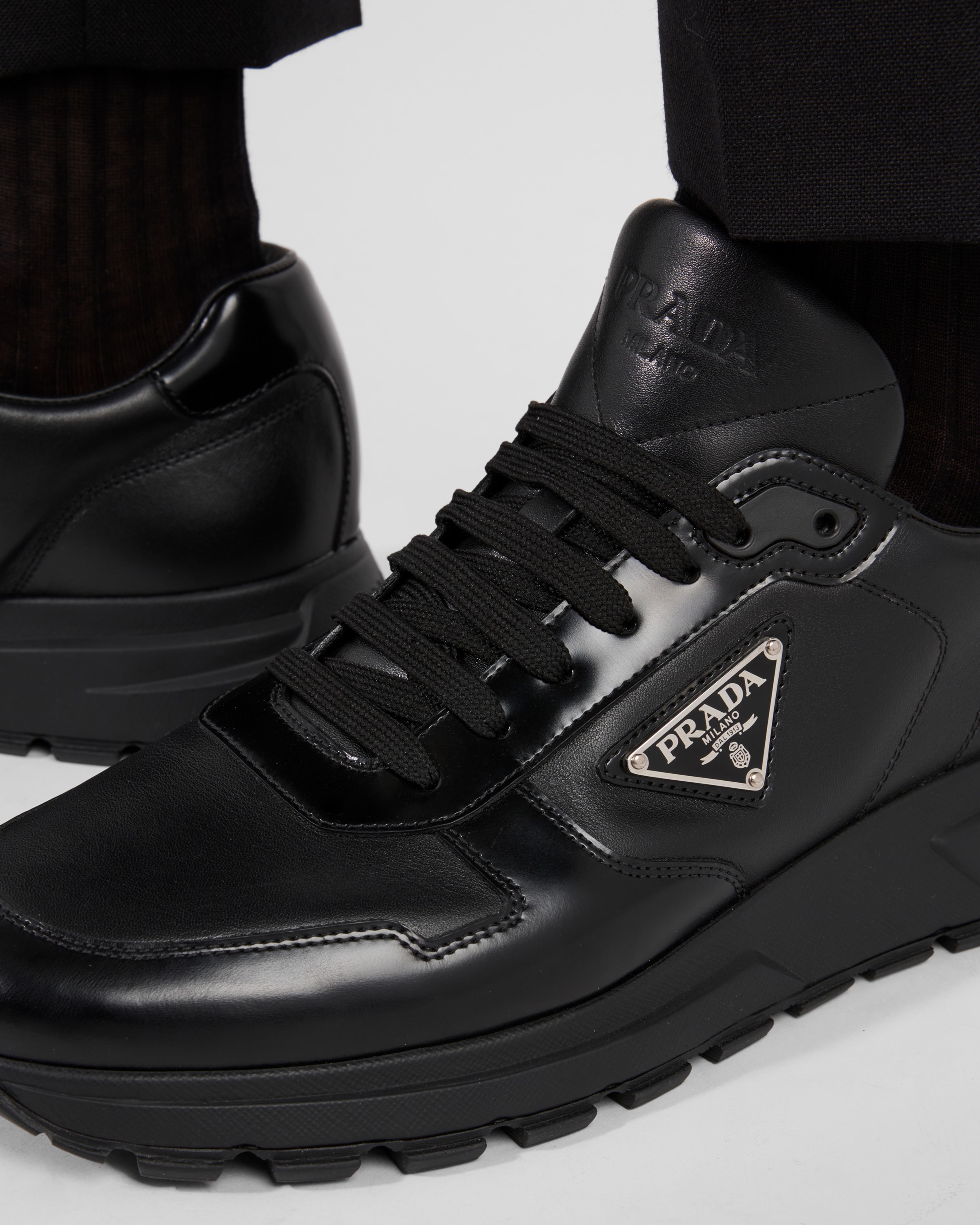 Prada Downtown Nappa Leather And Nylon Sneakers In Black