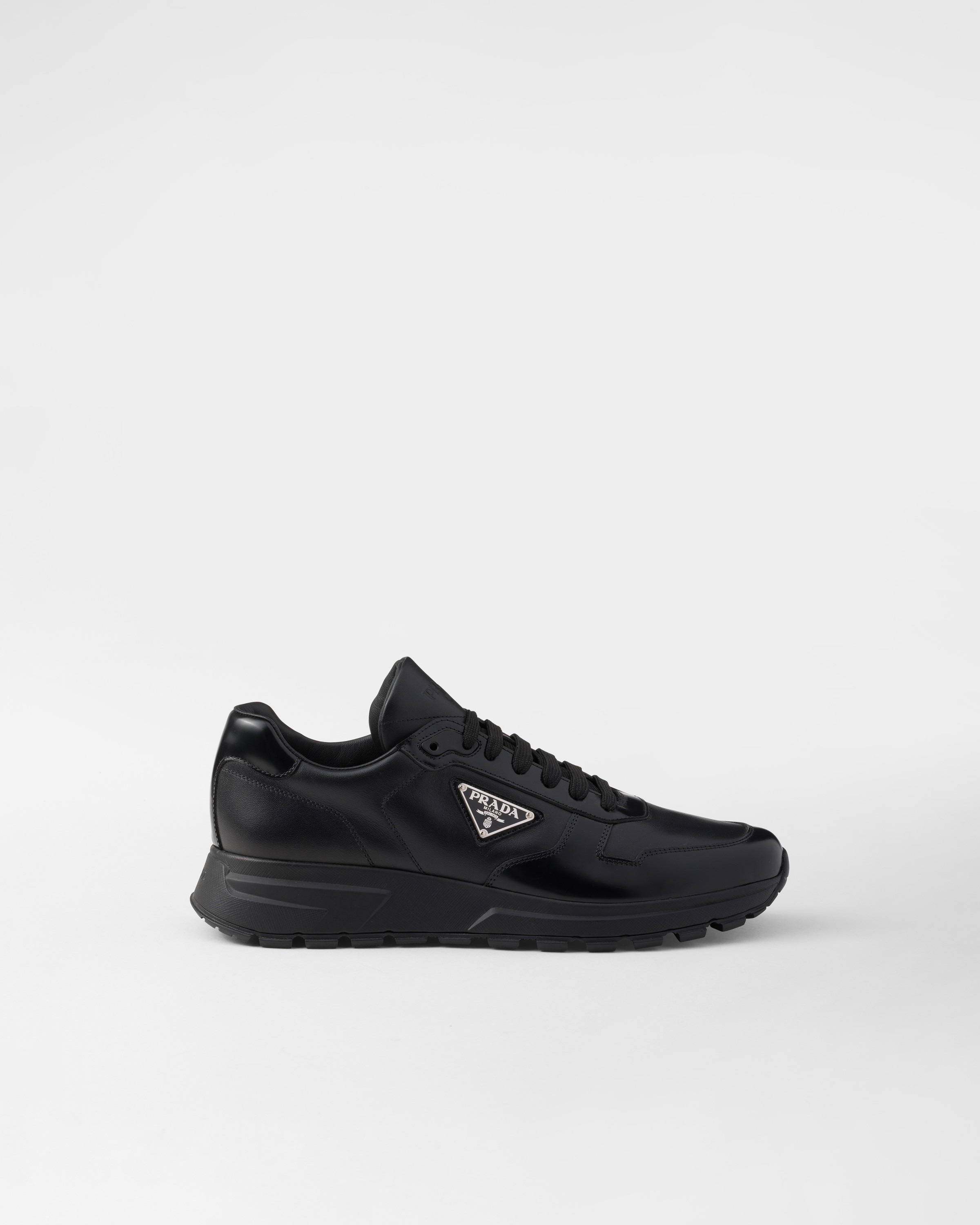 Shop Prada Leather Sneakers In Black