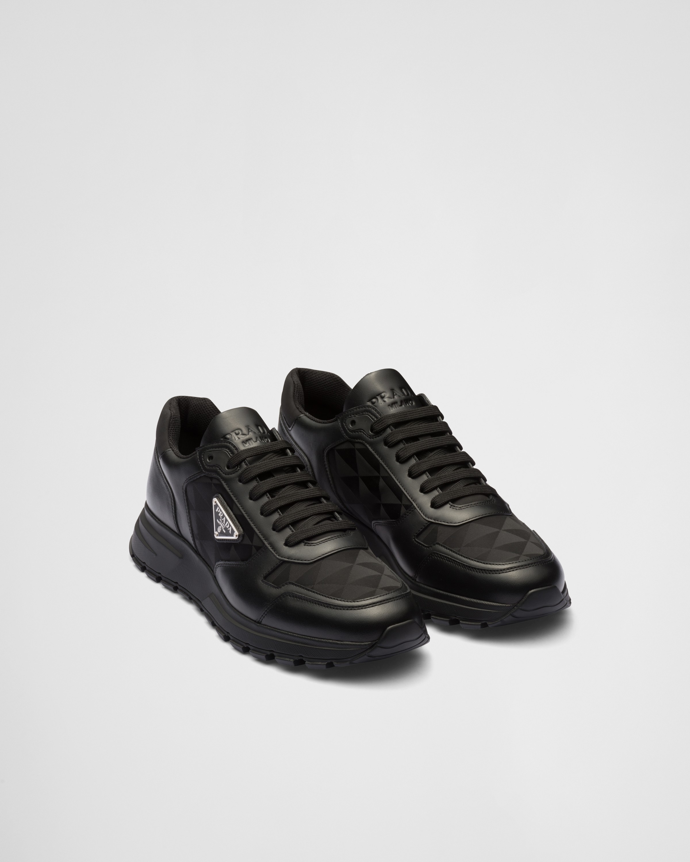 Shop Prada Leather And Re-nylon High-top Sneakers In Black