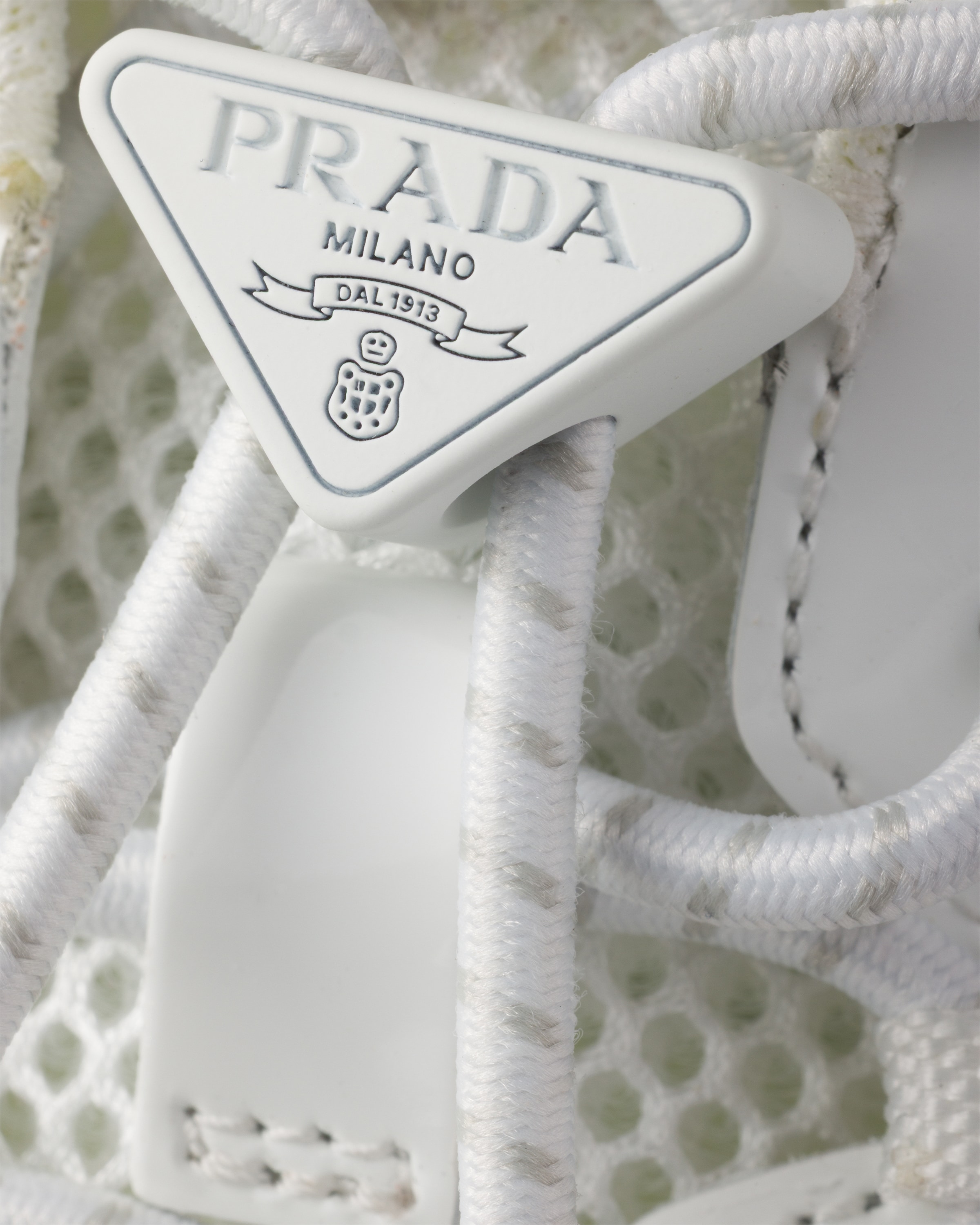 White Speedrock patent leather and mesh fabric sneakers | PRADA
