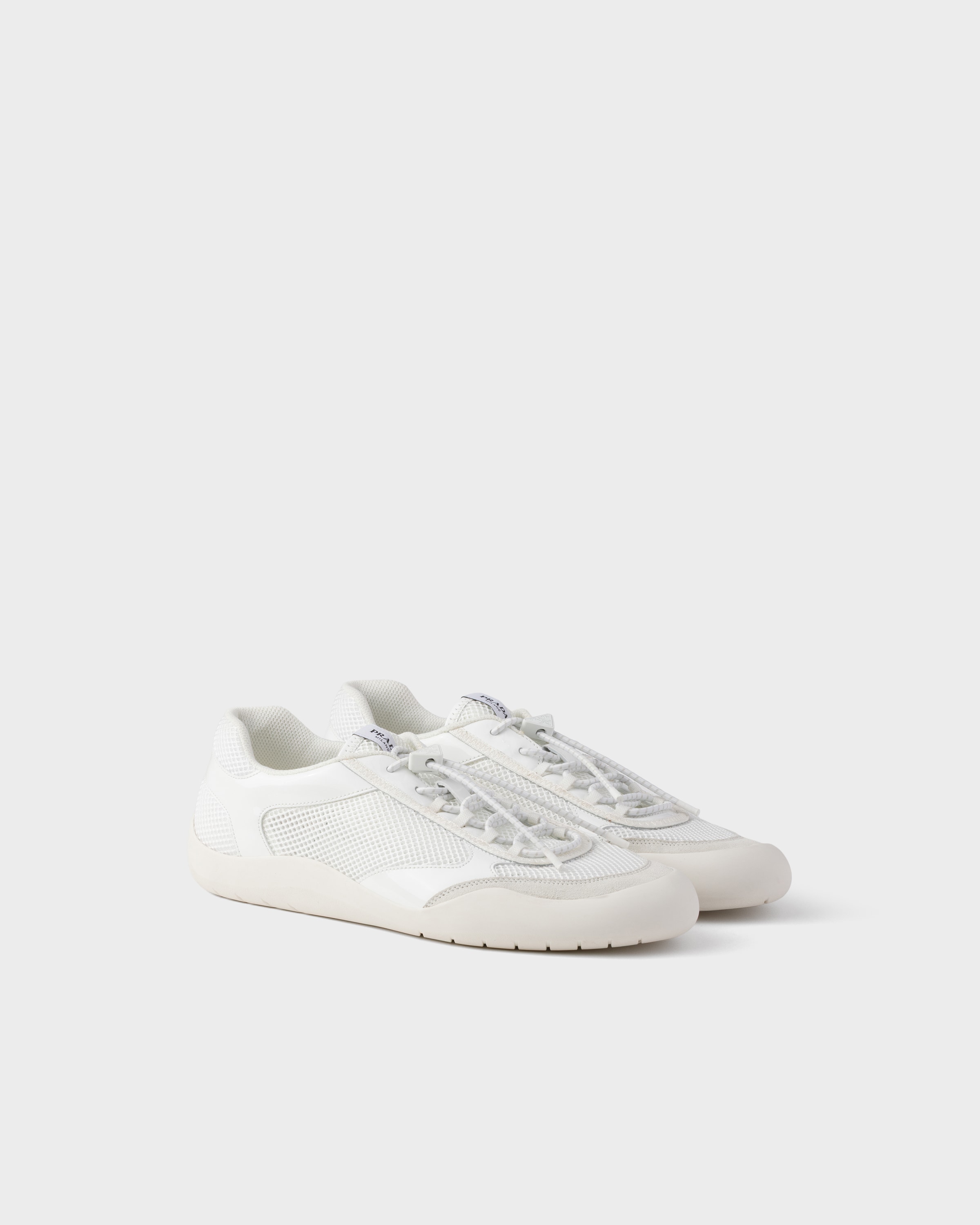 White Speedrock patent leather and mesh fabric sneakers | PRADA