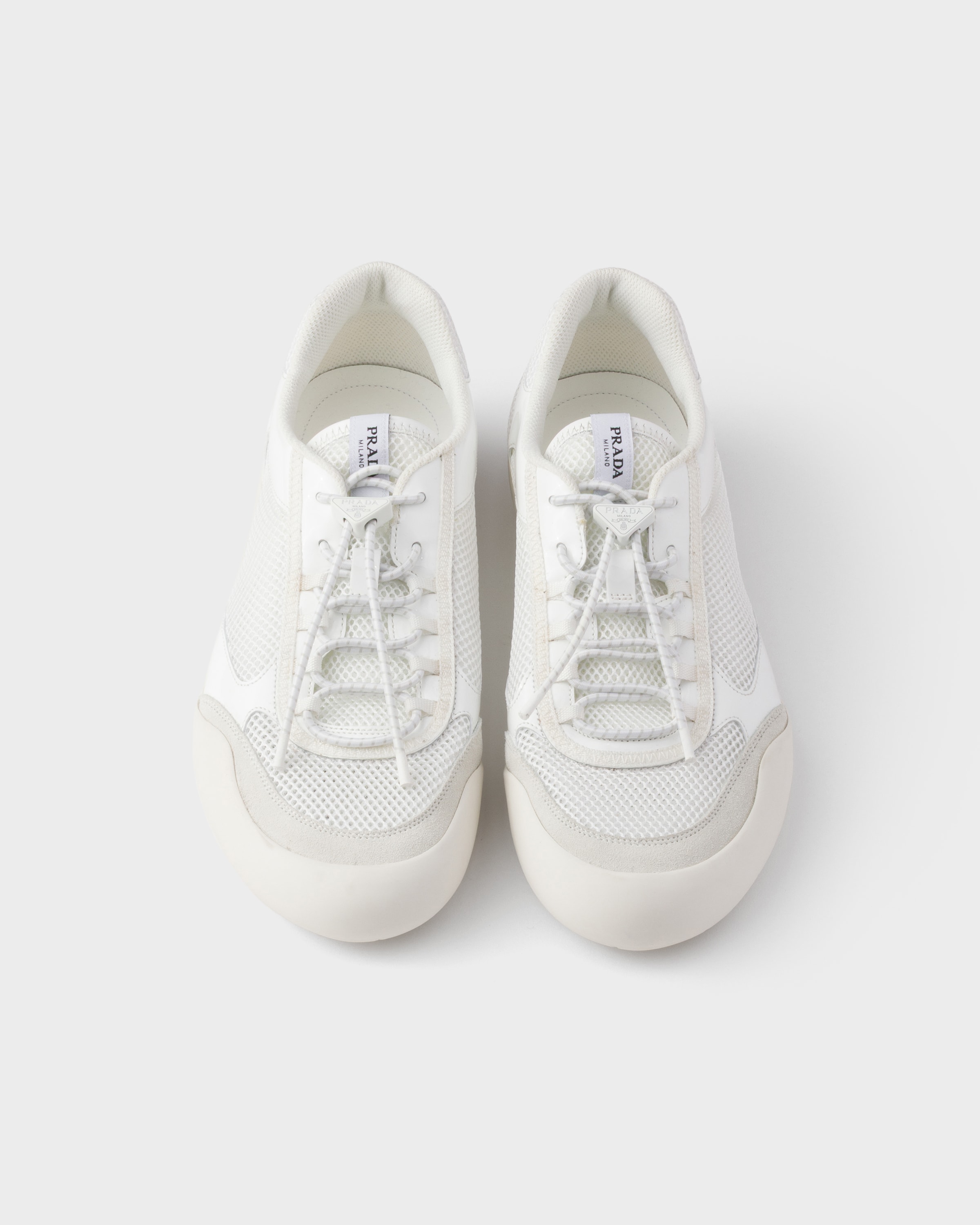 White Speedrock patent leather and mesh fabric sneakers | PRADA