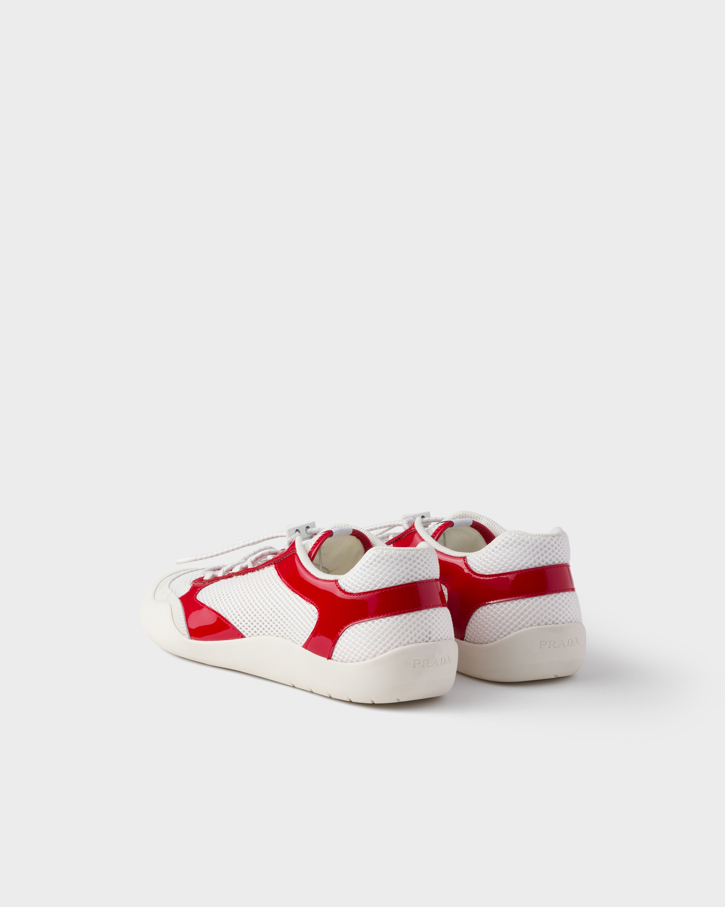 Red Speedrock patent leather and mesh fabric sneakers | PRADA