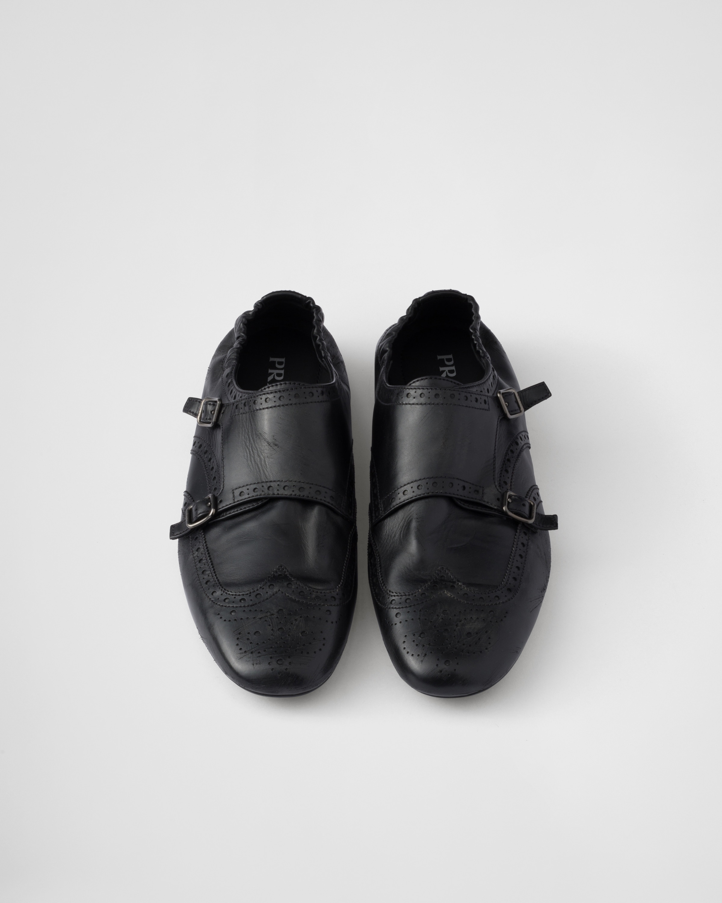 Black Shuffle double monk strap shoes | PRADA