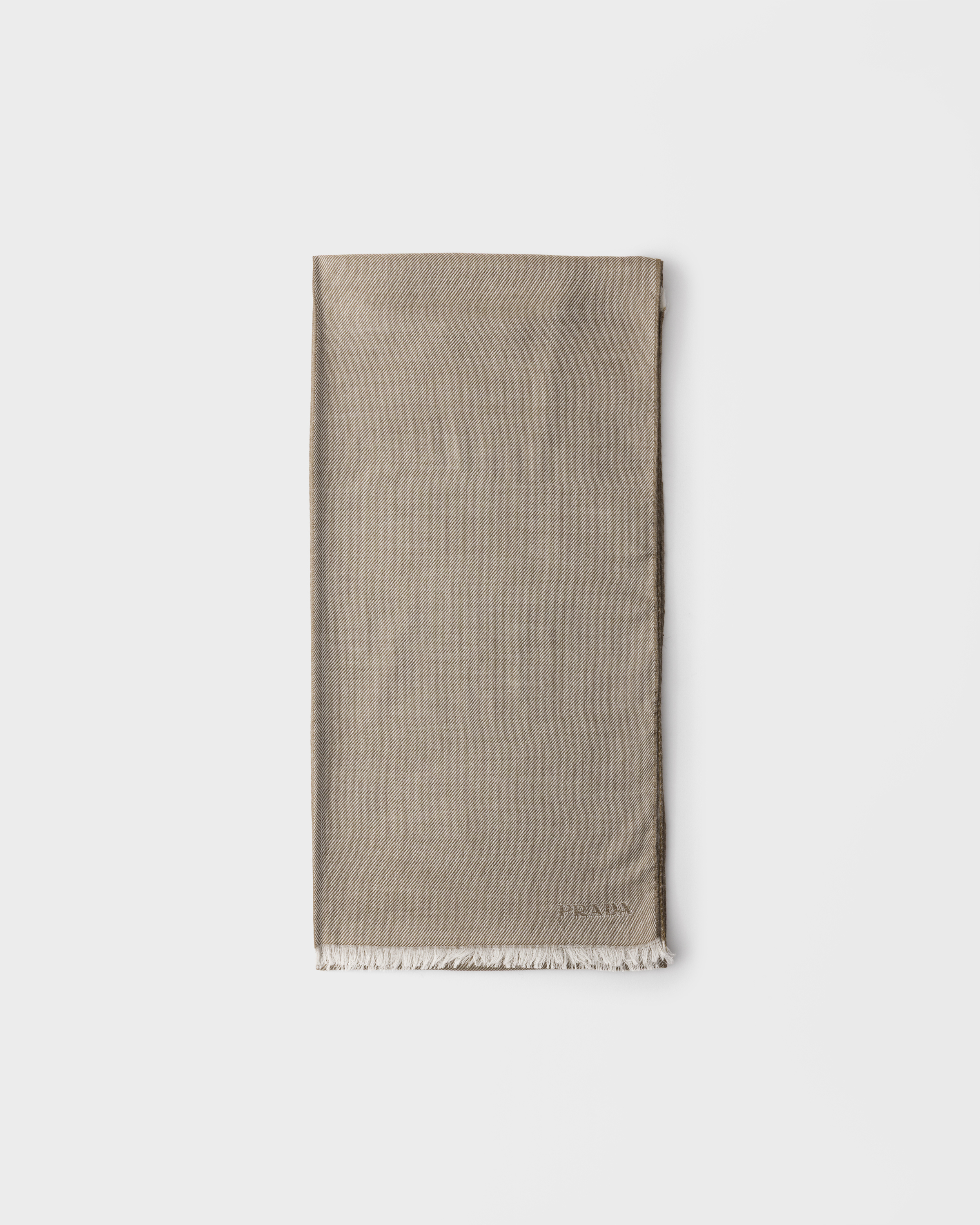 Single-tone scarf featuring fringe at bottom edge