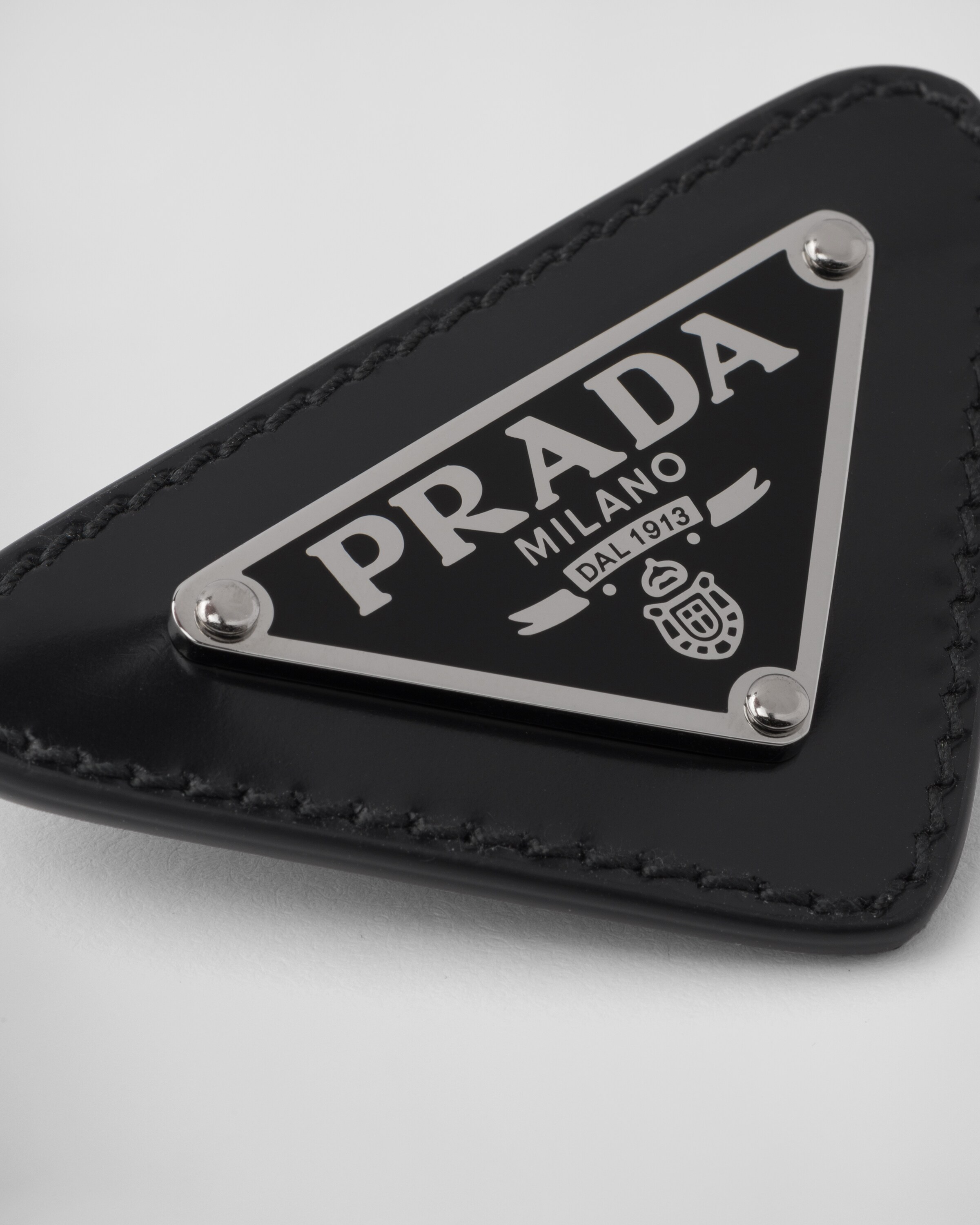 Black Brushed leather brooch Prada