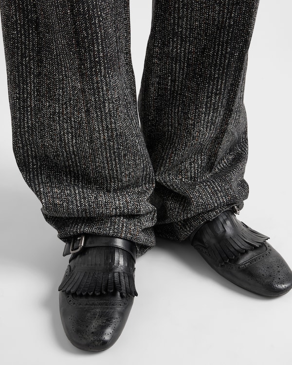 Shuffle antiqued leather mules with buckled strap and fringe Shuffle antiqued leather mules with buckled strap and fringe