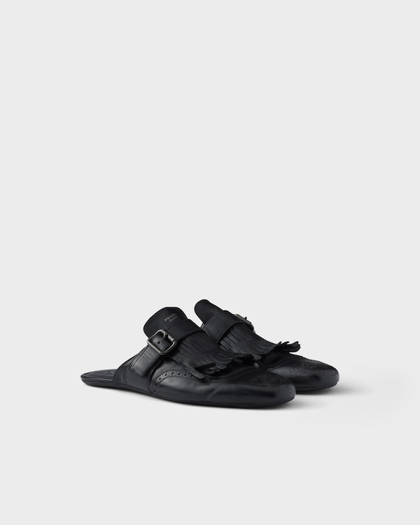 Shuffle antiqued leather mules with buckled strap and fringe - Black Shuffle antiqued leather mules with buckled strap and fringe - Black