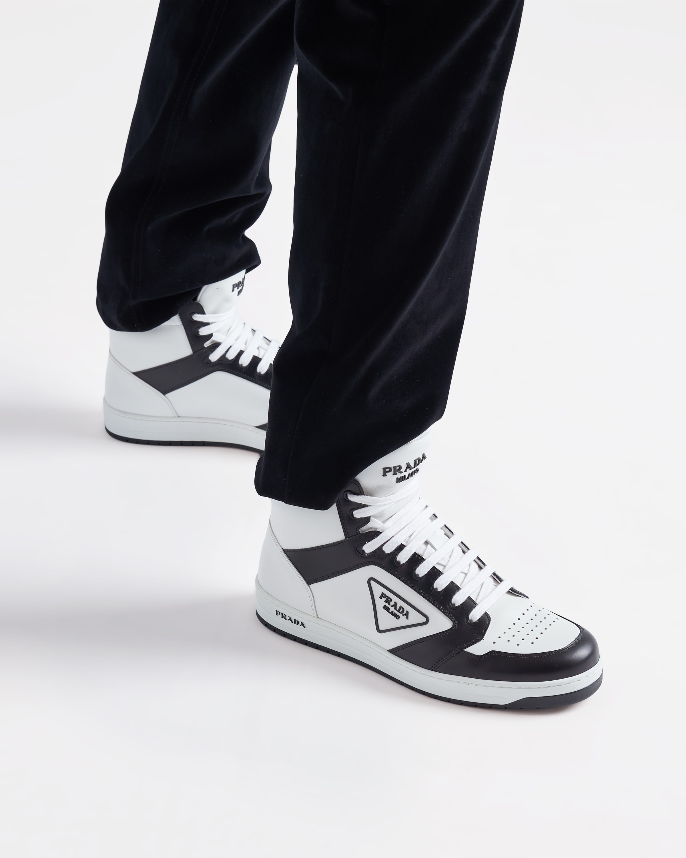 White/black District leather sneakers | Prada