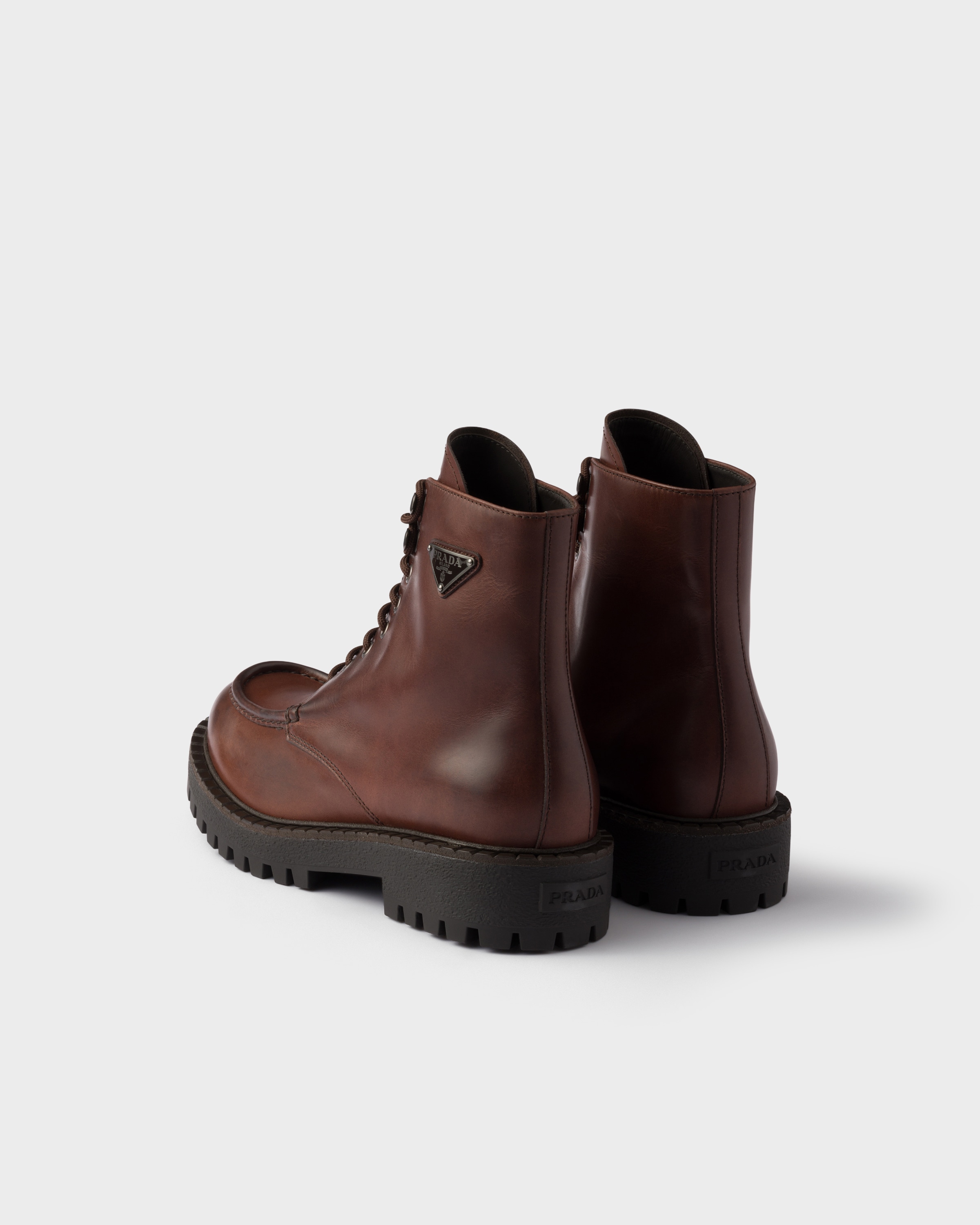 Prada Lace-up Lug-sole Boots In Black