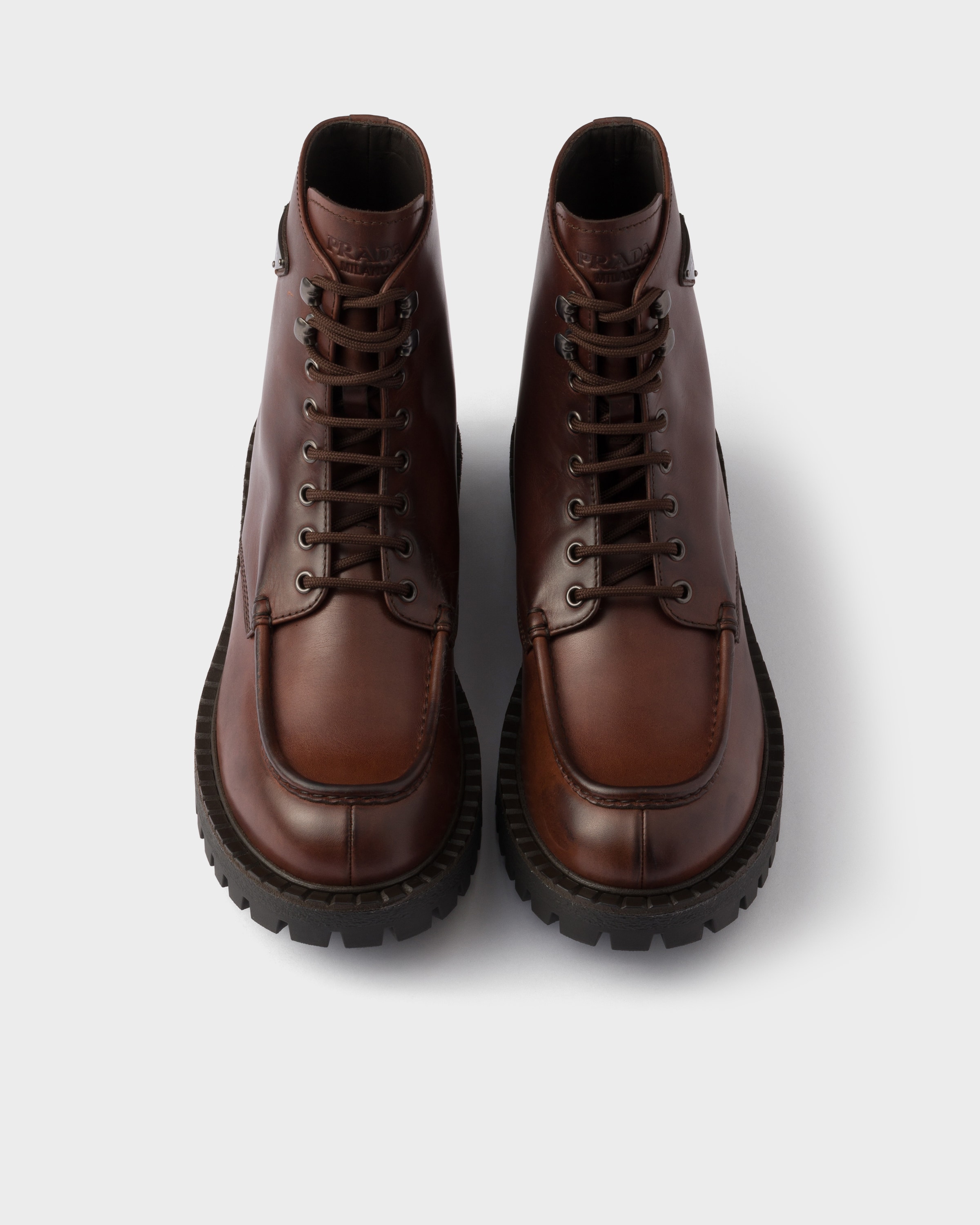 Prada Lace-up Lug-sole Boots In Black