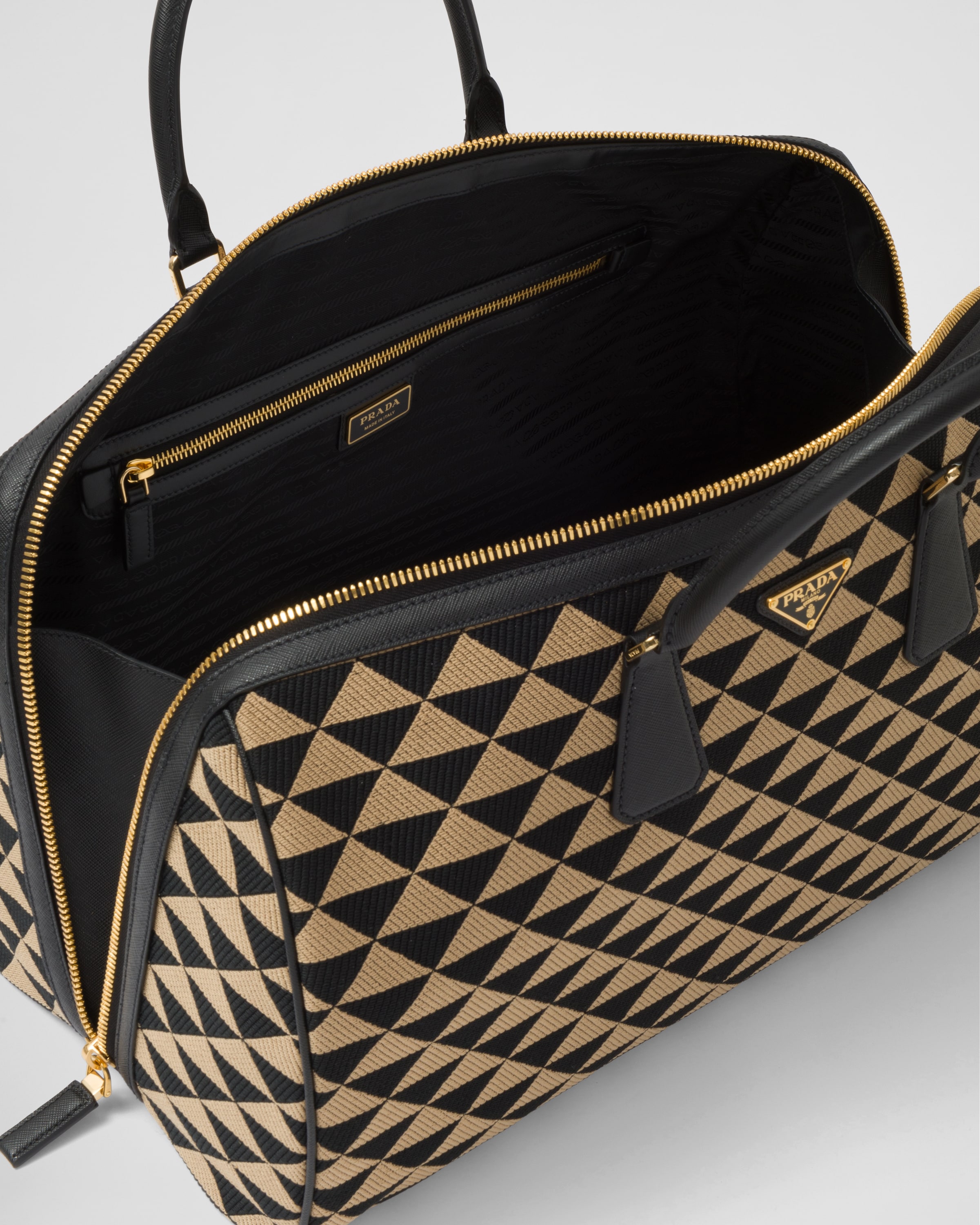 Medium Prada Symbole embroidered fabric travel bag