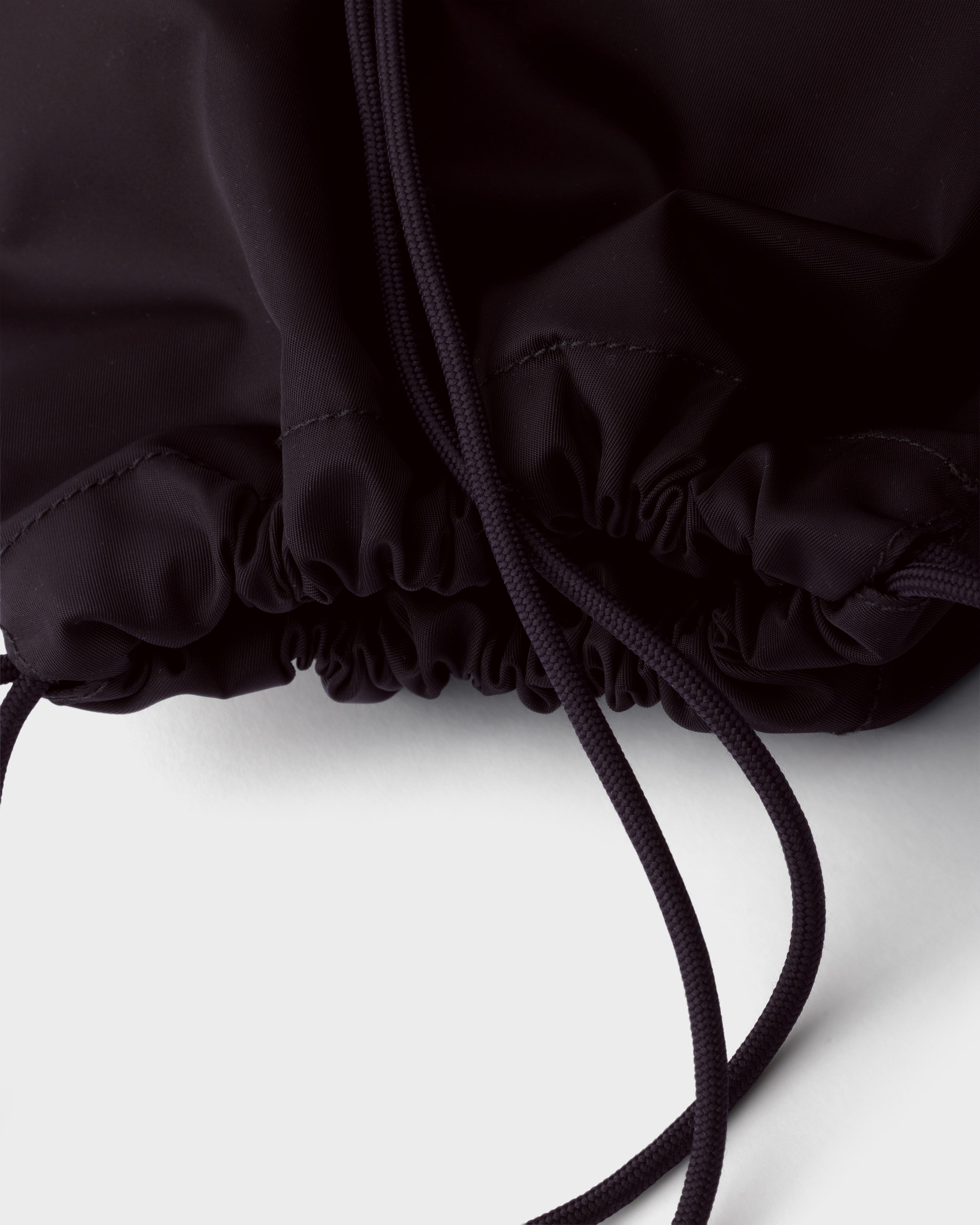 Black Re-Nylon drawstring backpack | PRADA - United States