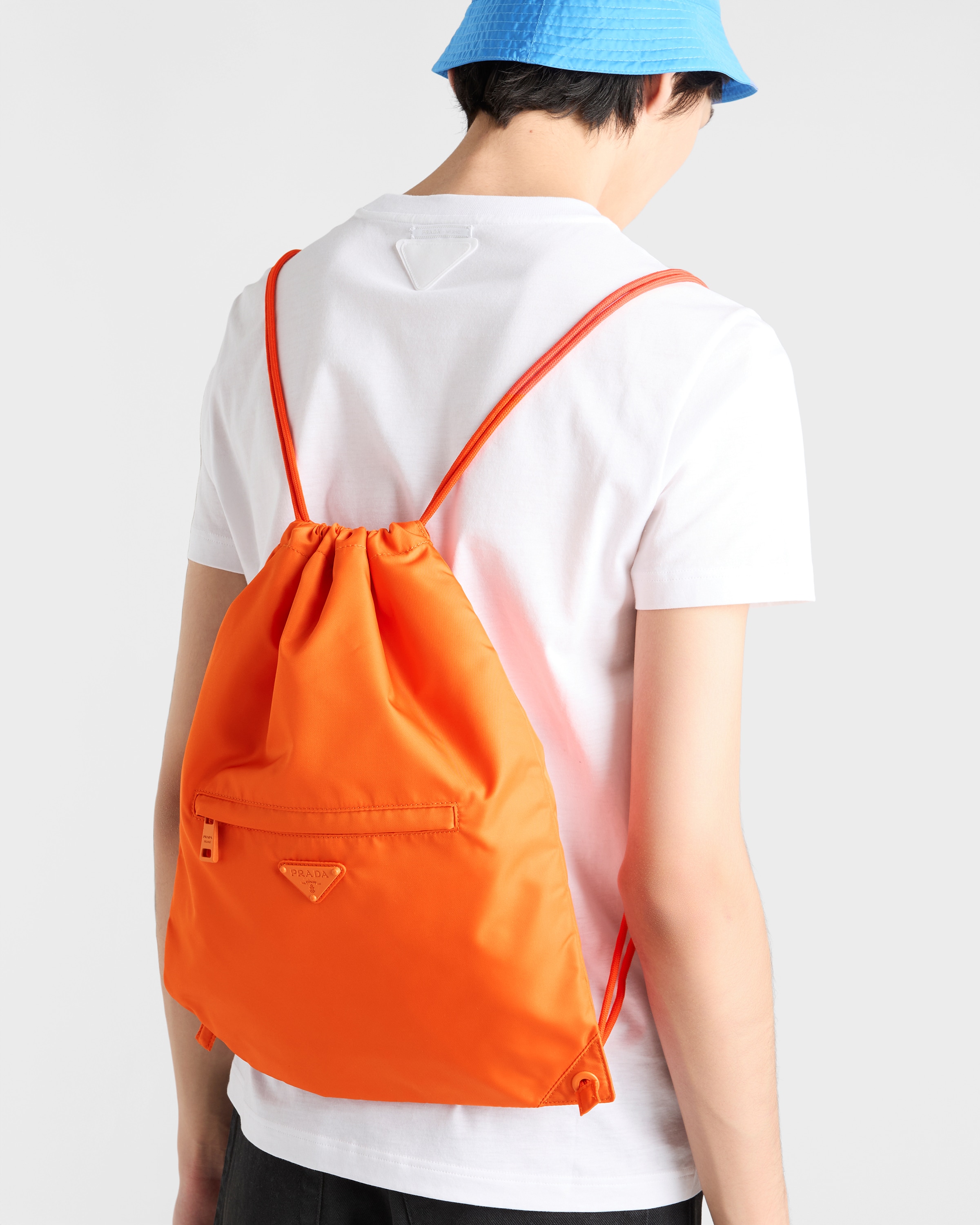ゆ*ゆ様 PRADA オレンジ ナイロンドローストリングバッグ Orange Re-Nylon drawstring backpack | PRADA - United States