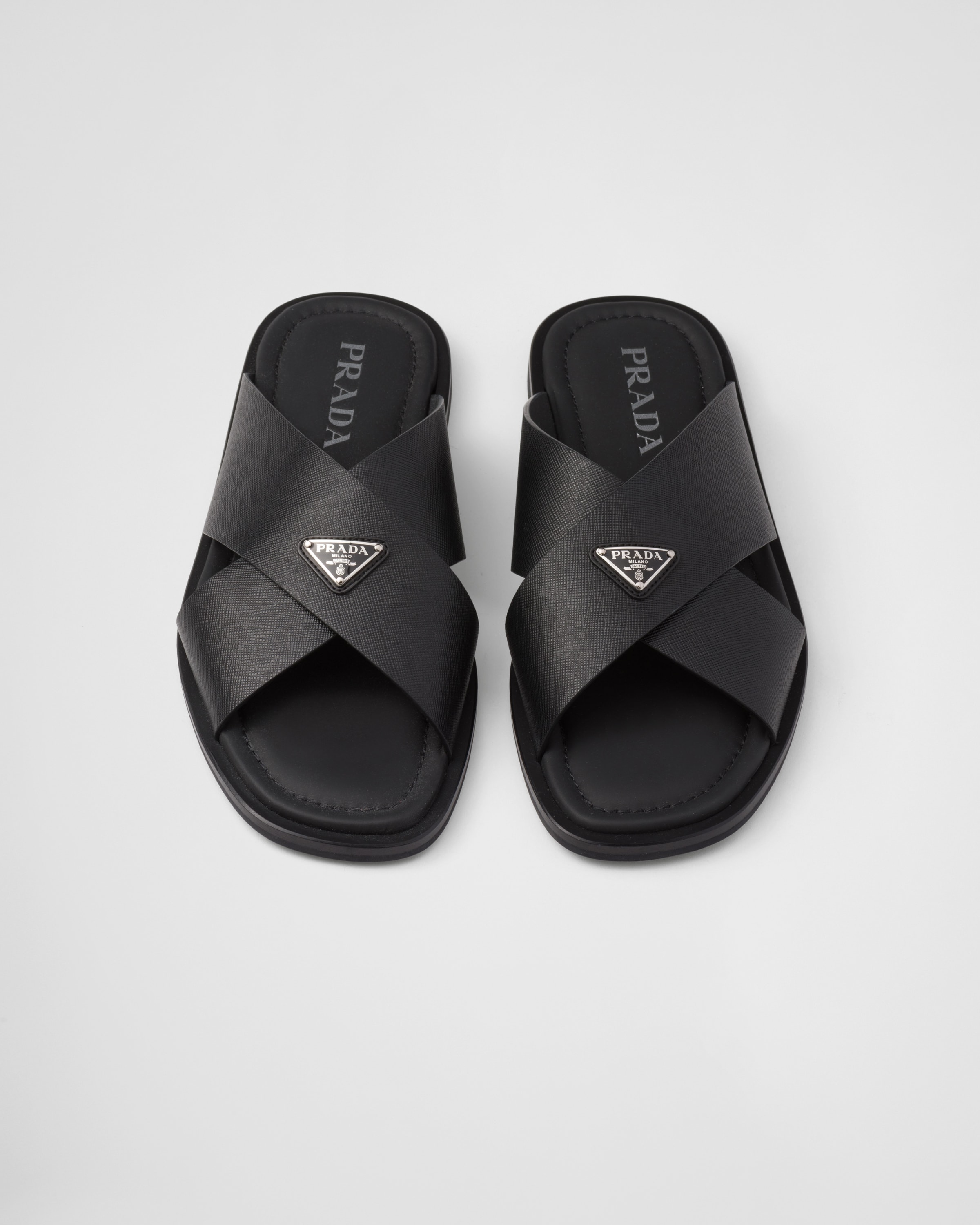 Shop Prada Saffiano Leather Crisscross Slides In Black