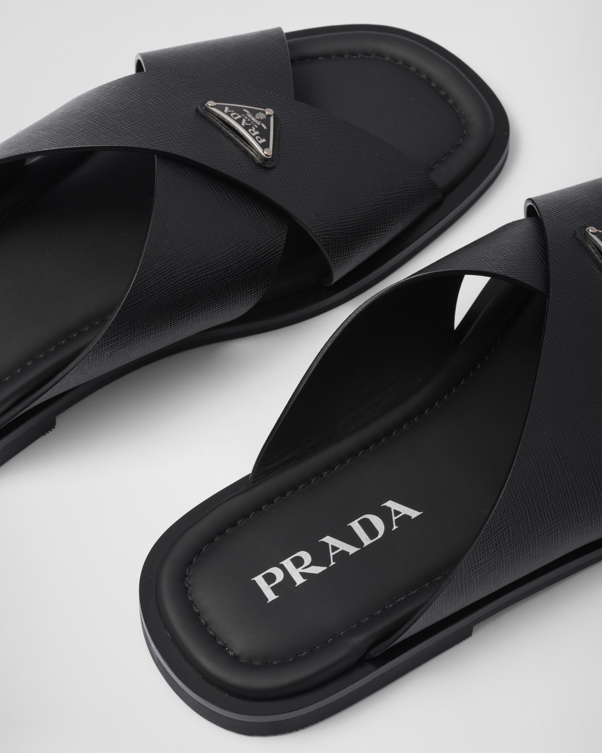 Black Saffiano leather crisscross sandals | Prada