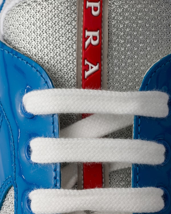 سنيكيرز Prada America's Cup من الجلد اللمّاع وقماش تقني سنيكيرز Prada America's Cup من الجلد اللمّاع وقماش تقني