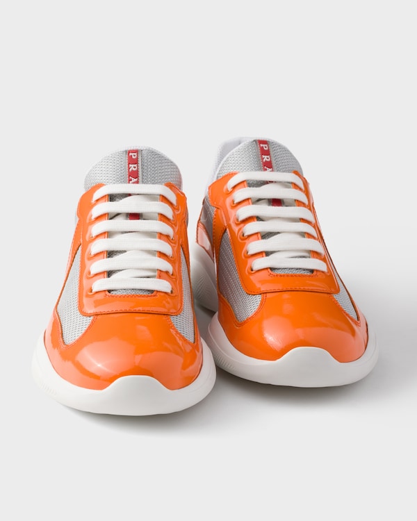 Sneakers Prada America’s Cup en cuir verni et tissu technique - Papaye/Argent Sneakers Prada America’s Cup en cuir verni et tissu technique - Papaye/Argent