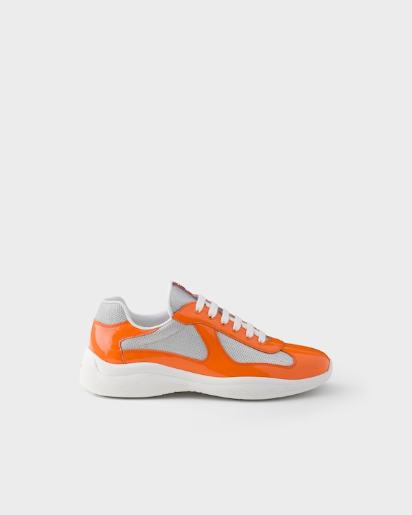 Sneakers Prada America’s Cup en cuir verni et tissu technique - Papaye/Argent Sneakers Prada America’s Cup en cuir verni et tissu technique - Papaye/Argent