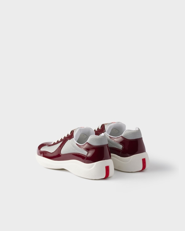 Prada America’s Cup Sneaker aus Lackleder und Funktionsgewebe - Weinrot-Silber Prada America’s Cup Sneaker aus Lackleder und Funktionsgewebe - Weinrot-Silber