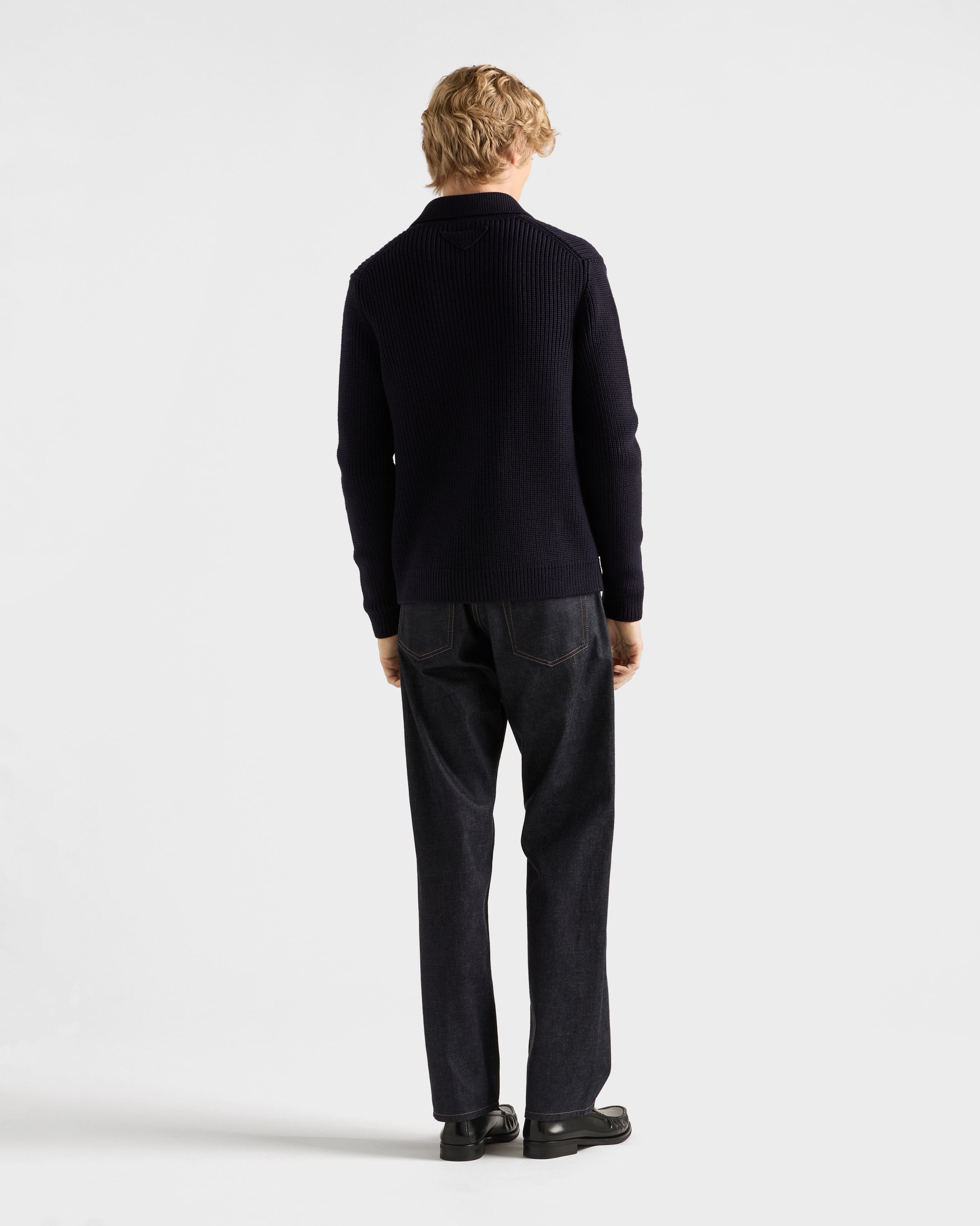Raw denim jeans with leather strap