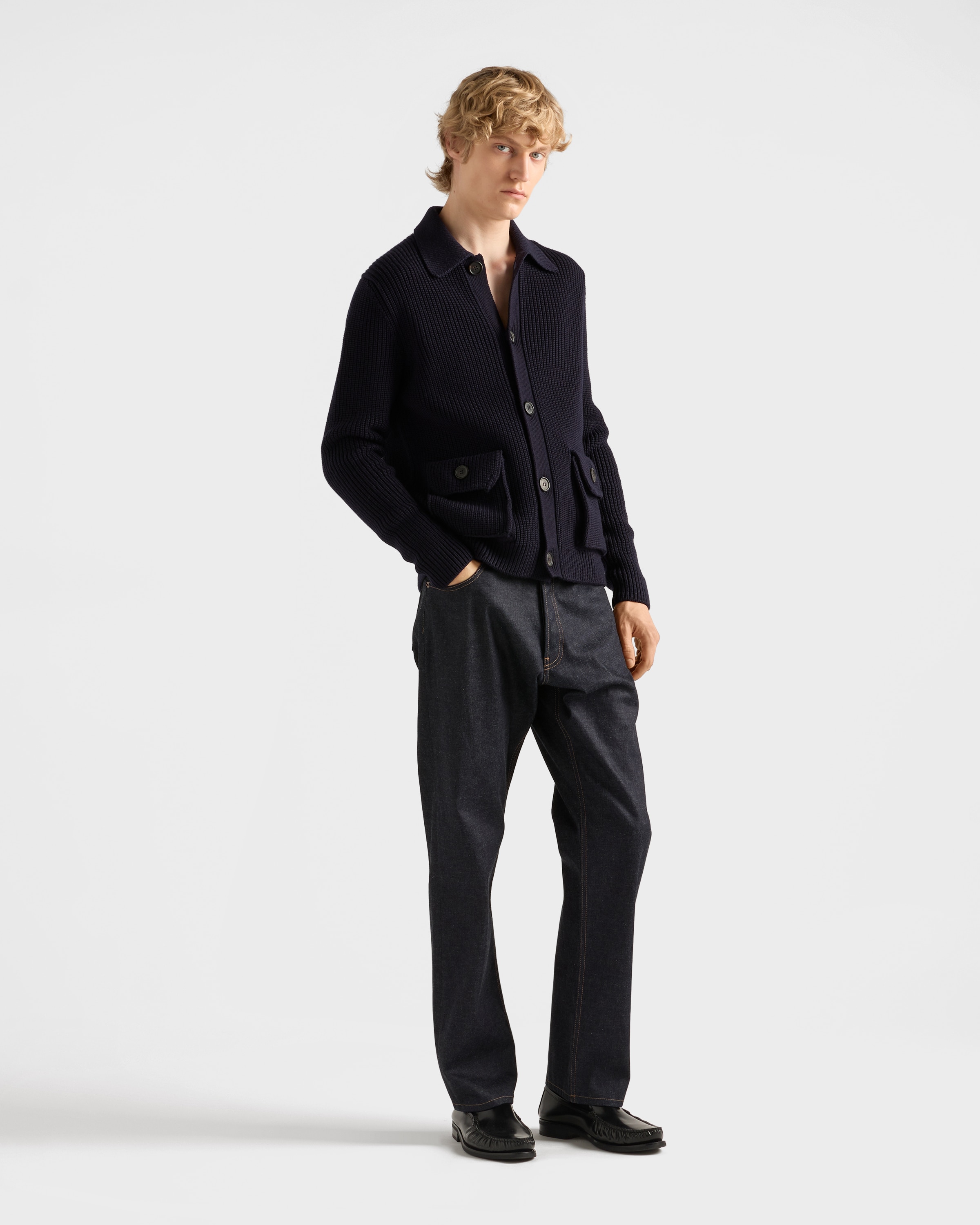 Raw denim jeans with leather strap