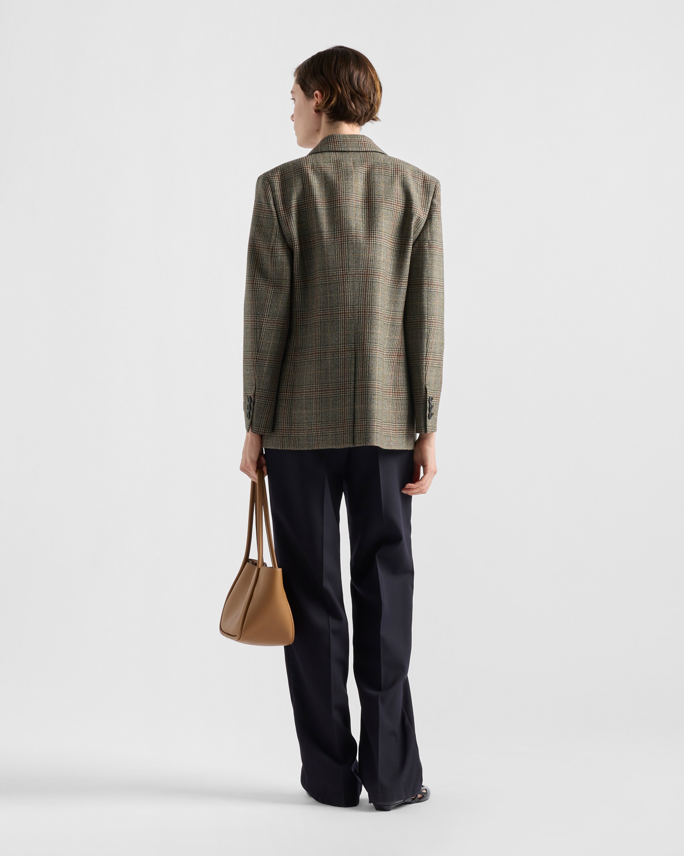 Navy Old-wash gabardine pants with jeweled brooch | PRADA