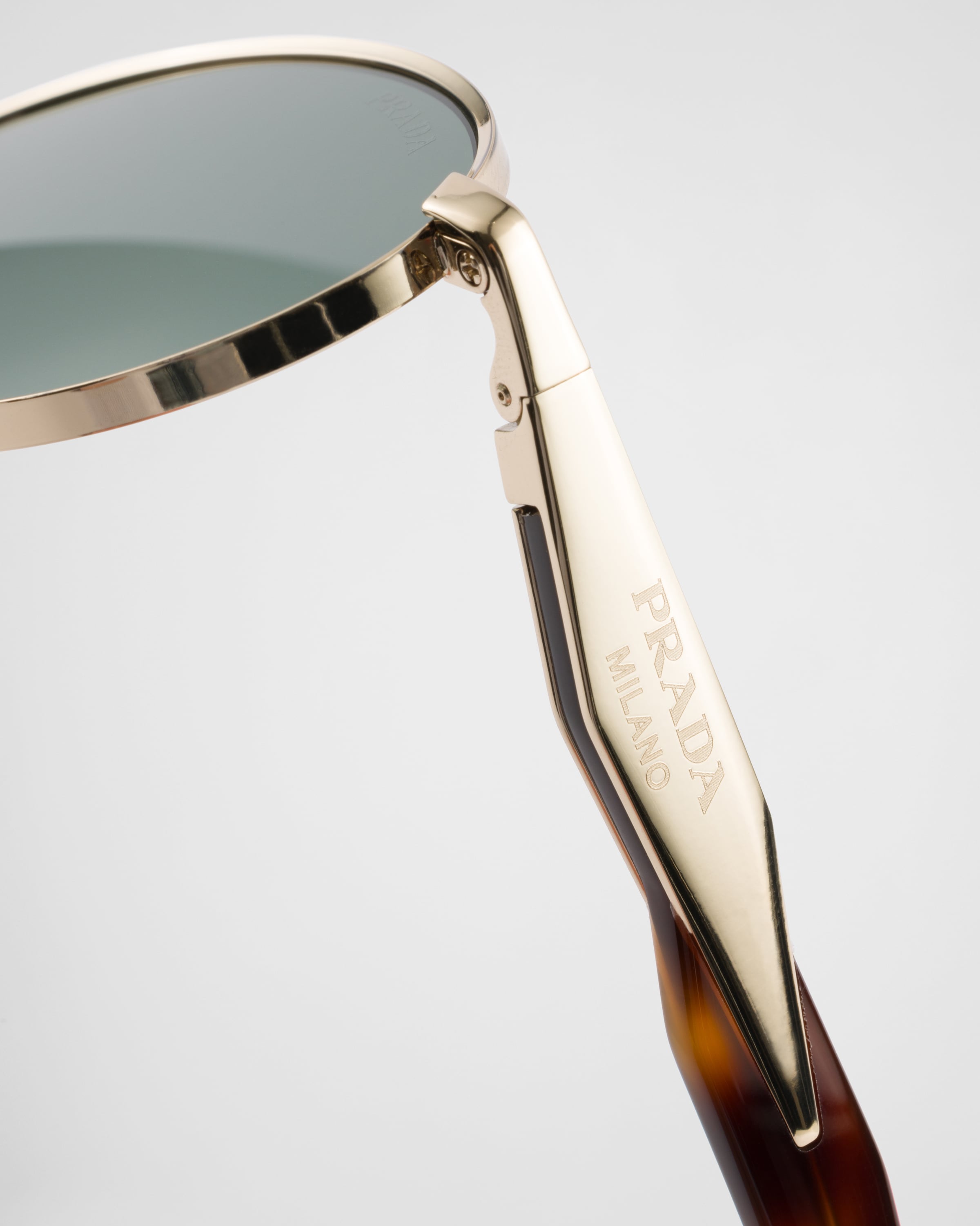 Forest green lenses Prada Eyewear Collection sunglasses | PRADA