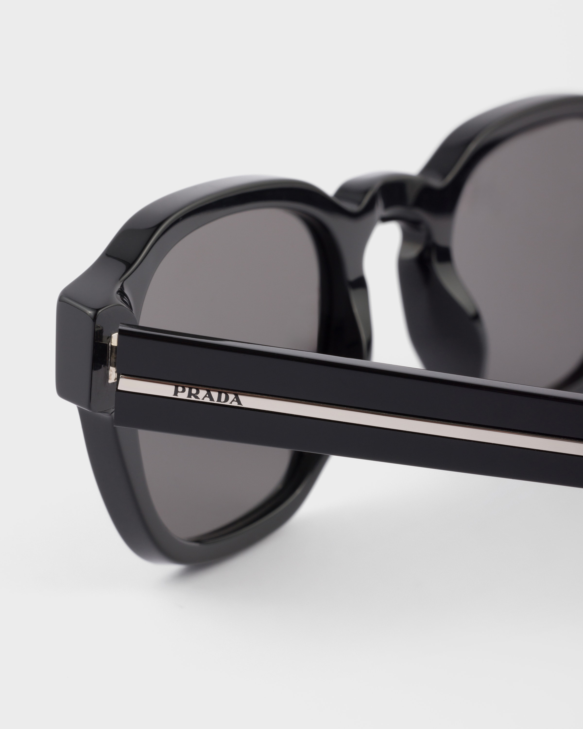 Sunglasses with the iconic metal plaque