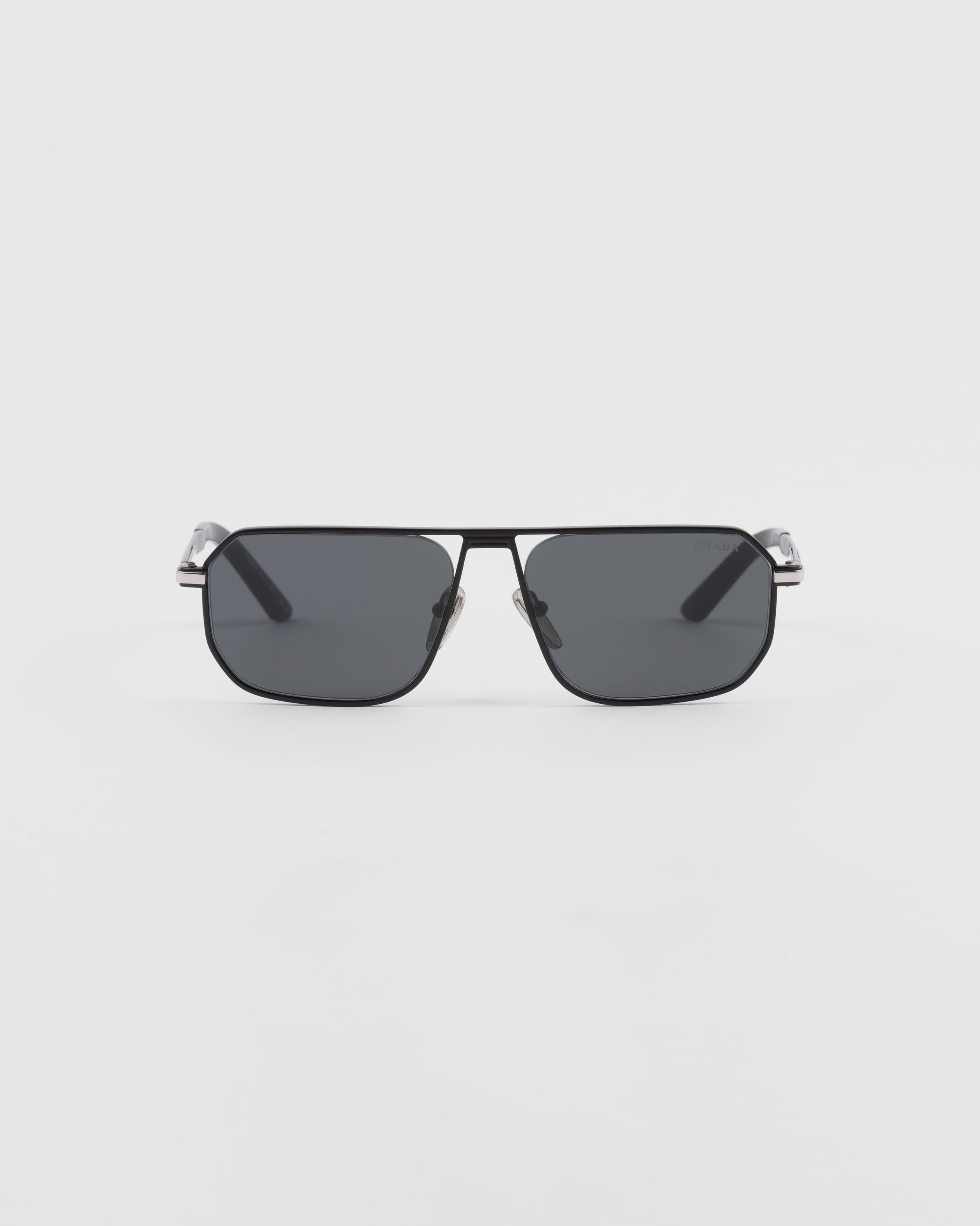 PRADA SUNGLASSES WITH ICONIC METAL PLAQUE