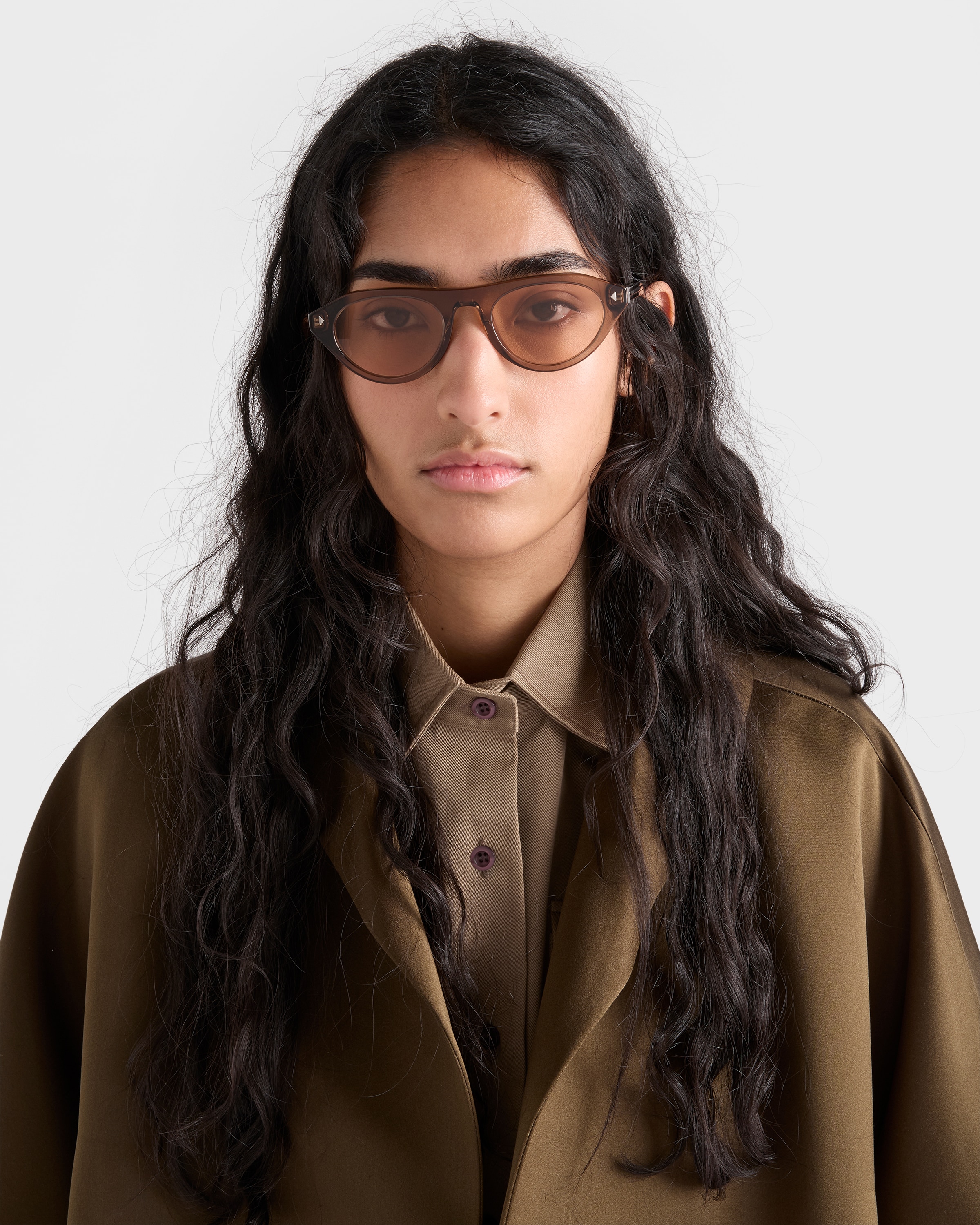Crystal lenses Prada sunglasses with the iconic metal plaque