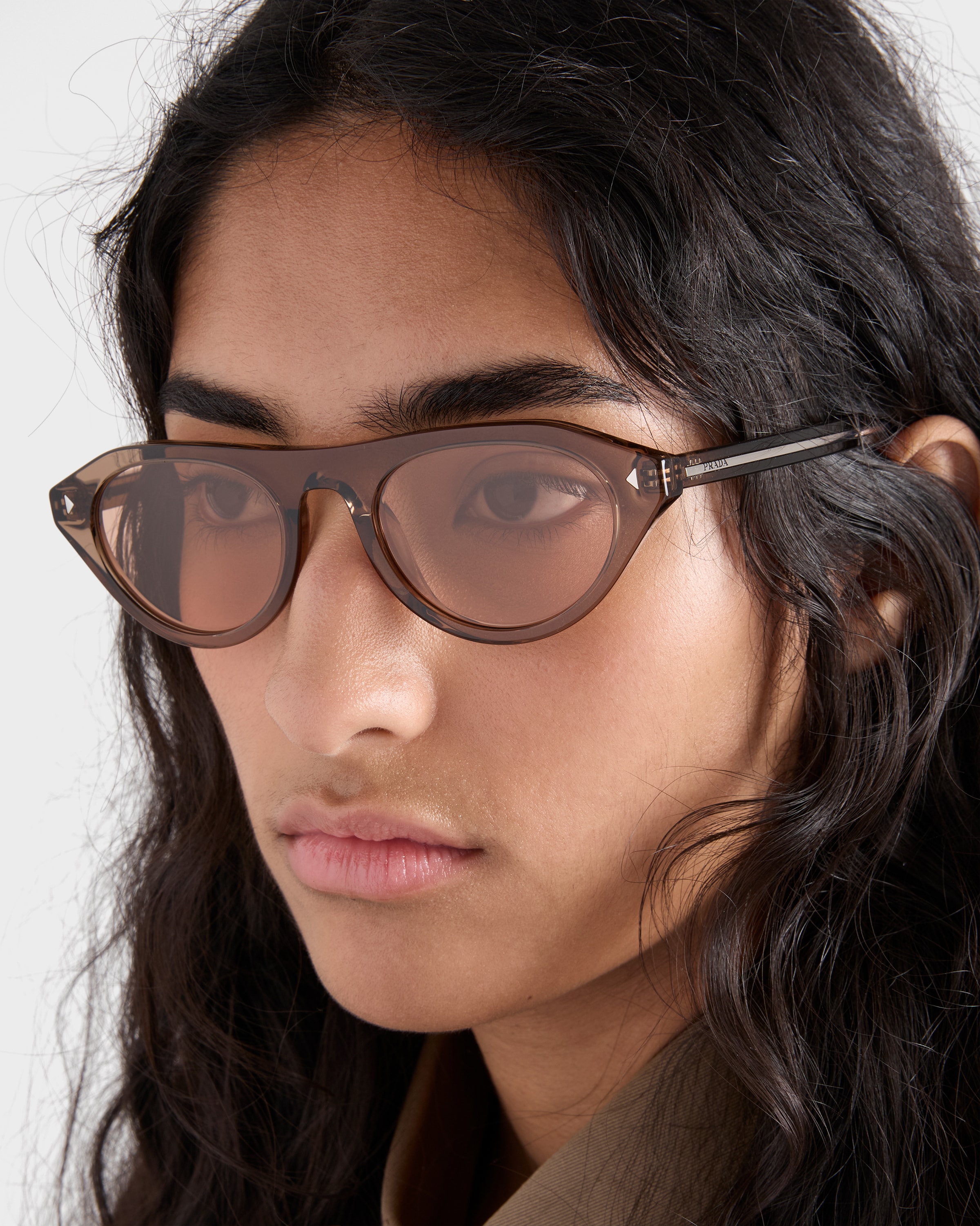 Crystal lenses Prada sunglasses with the iconic metal plaque