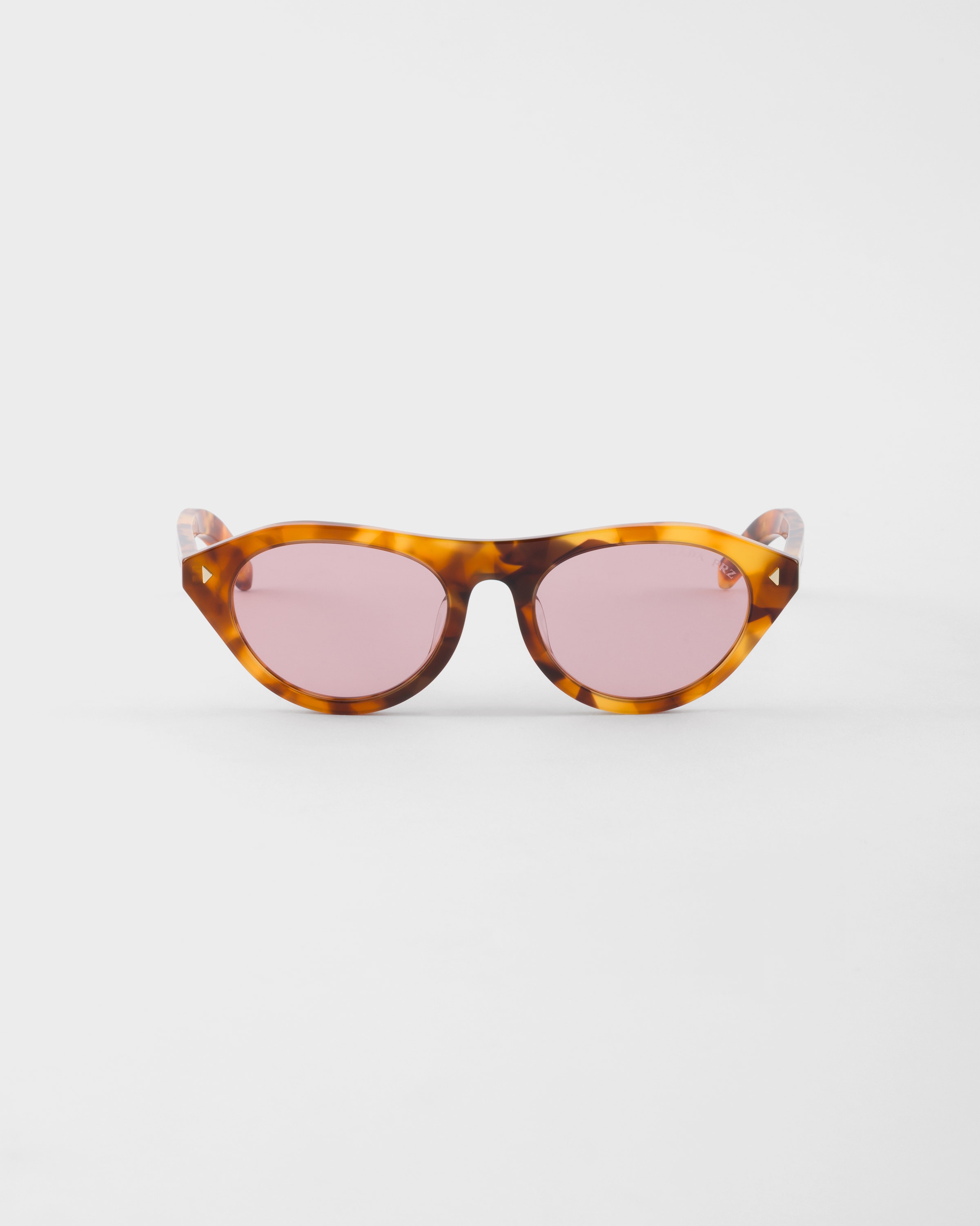 Fuchsia lenses Prada sunglasses with the iconic metal plaque