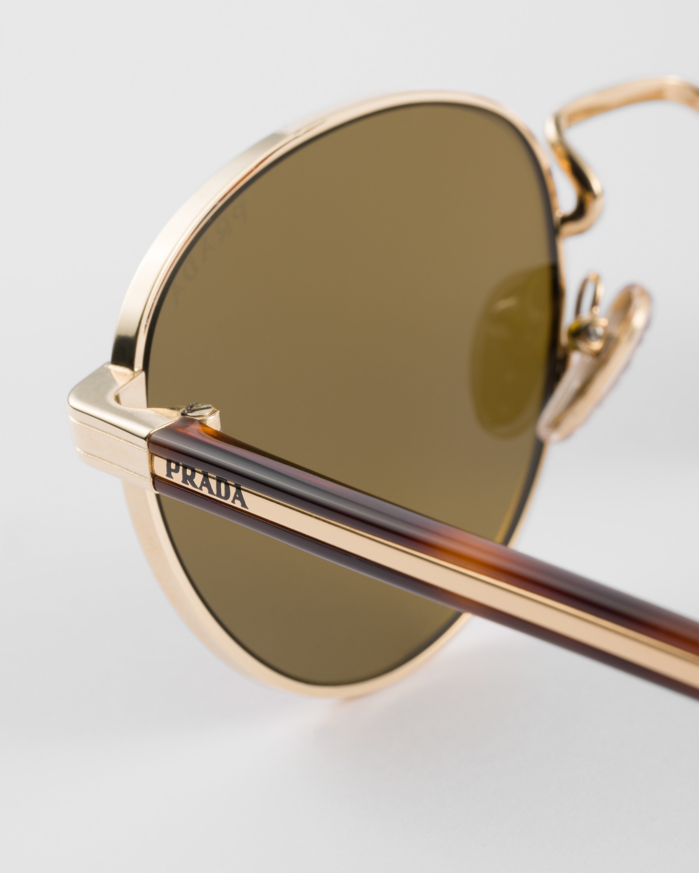 Prada Sunglasses With The Iconic Metal Plaque In Loden Green Lenses