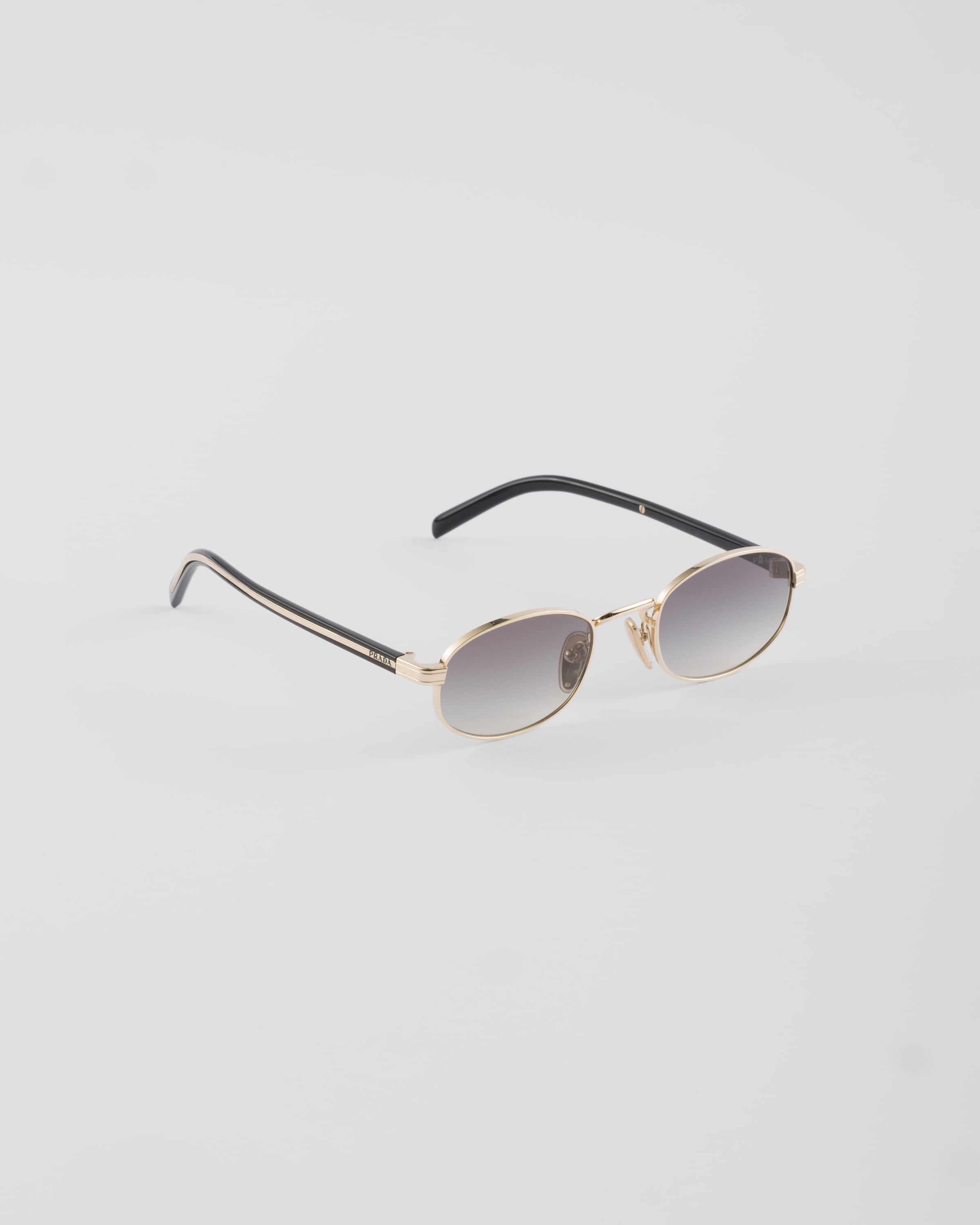 Slate Gray Lenses Sunglasses with the iconic metal plaque