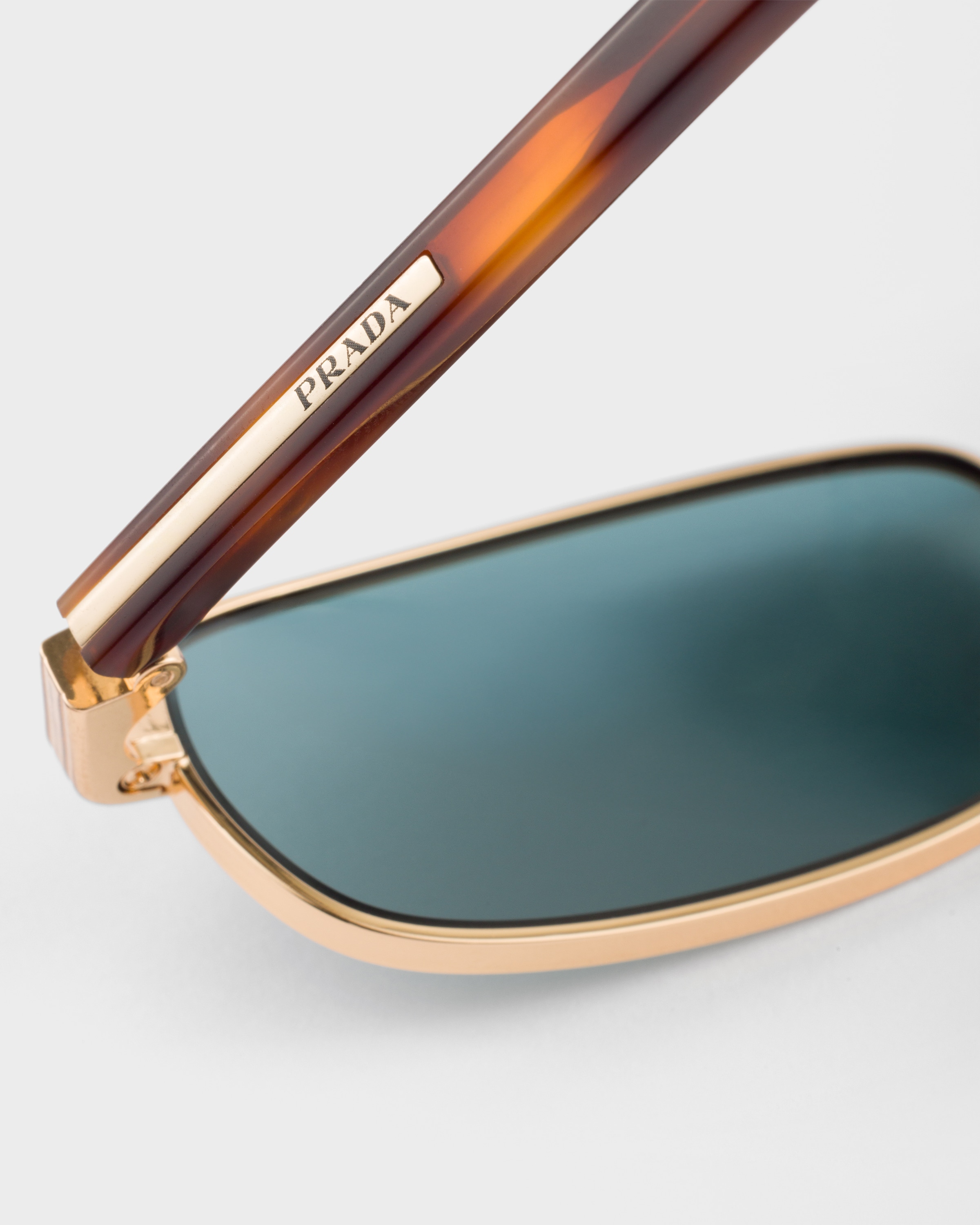 Lake Blue lenses Sunglasses with the iconic metal plaque | PRADA