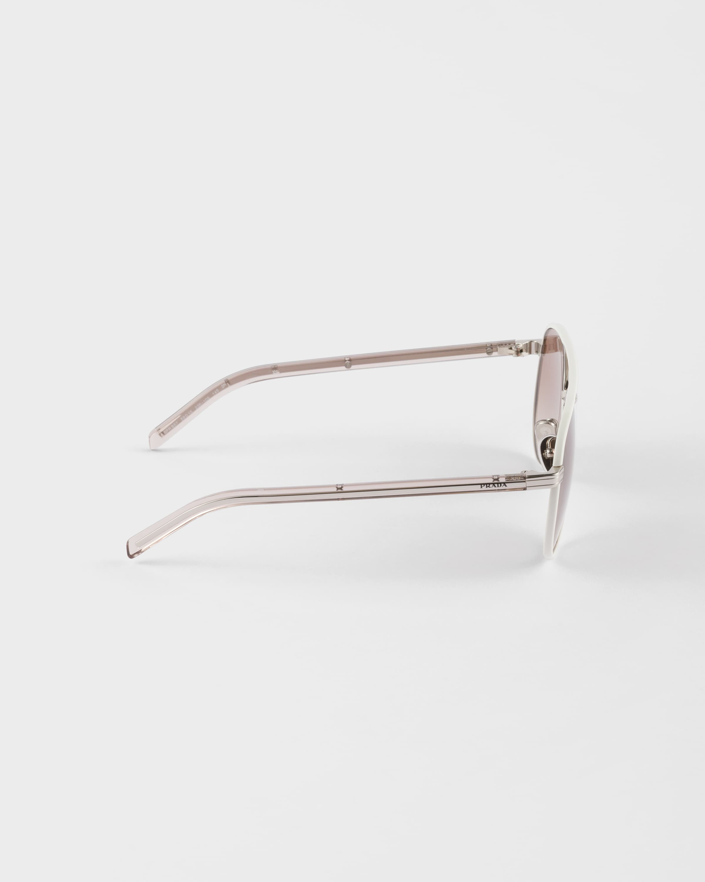 PRADA PRADA SUNGLASSES WITH THE ICONIC METAL PLAQUE