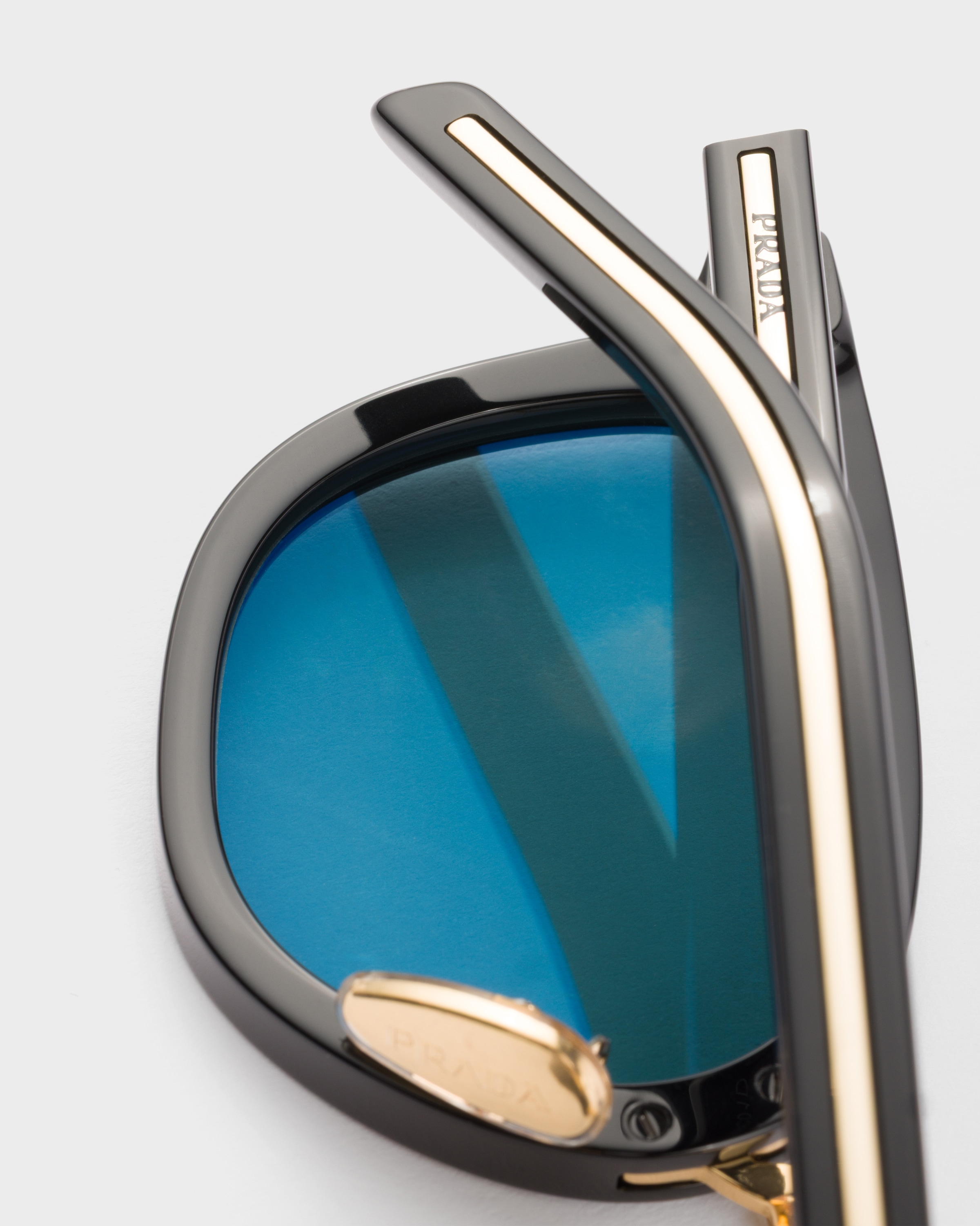 Turquoise Lenses Sunglasses With The Iconic Metal Plaque | PRADA