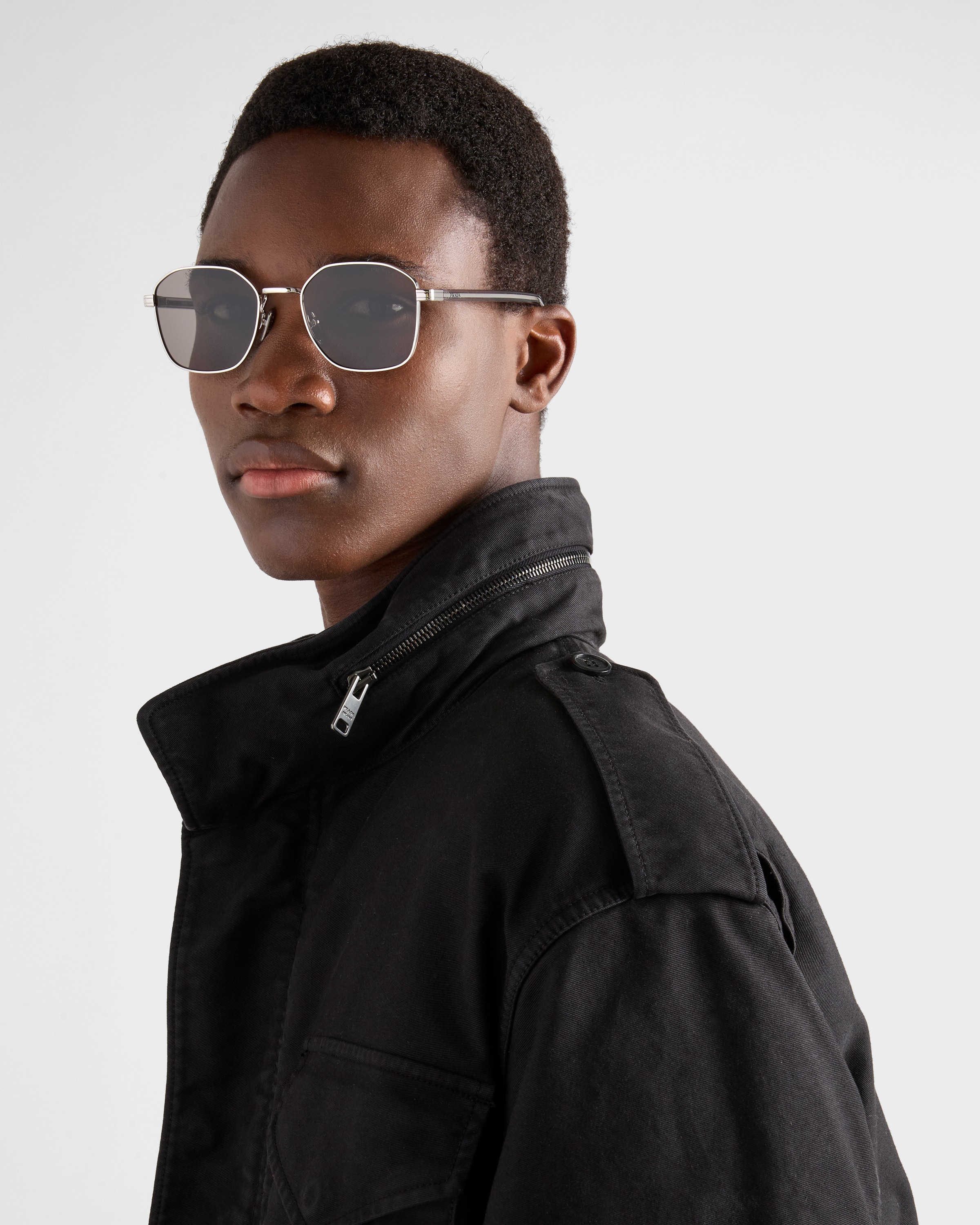 Sunglasses with the iconic metal plaque