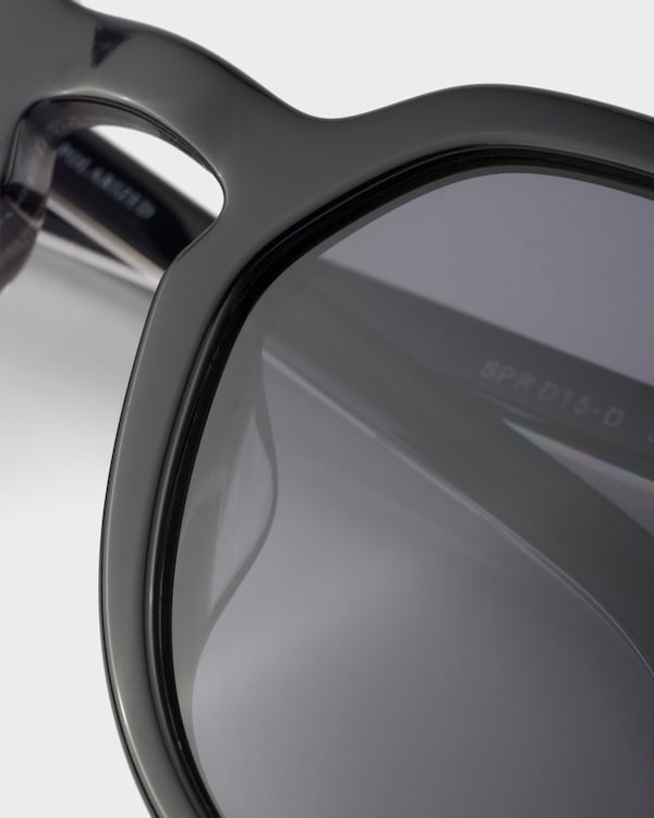 Prada sunglasses with the iconic metal plaque - Polarized black lenses Prada sunglasses with the iconic metal plaque - Polarized black lenses