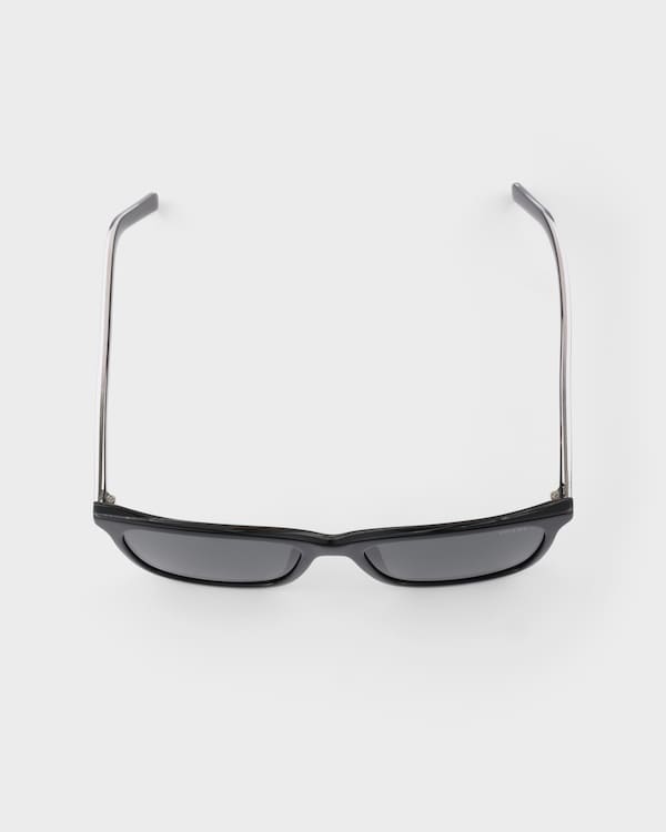 Prada sunglasses with the iconic metal plaque - Slate Lenses Prada sunglasses with the iconic metal plaque - Slate Lenses