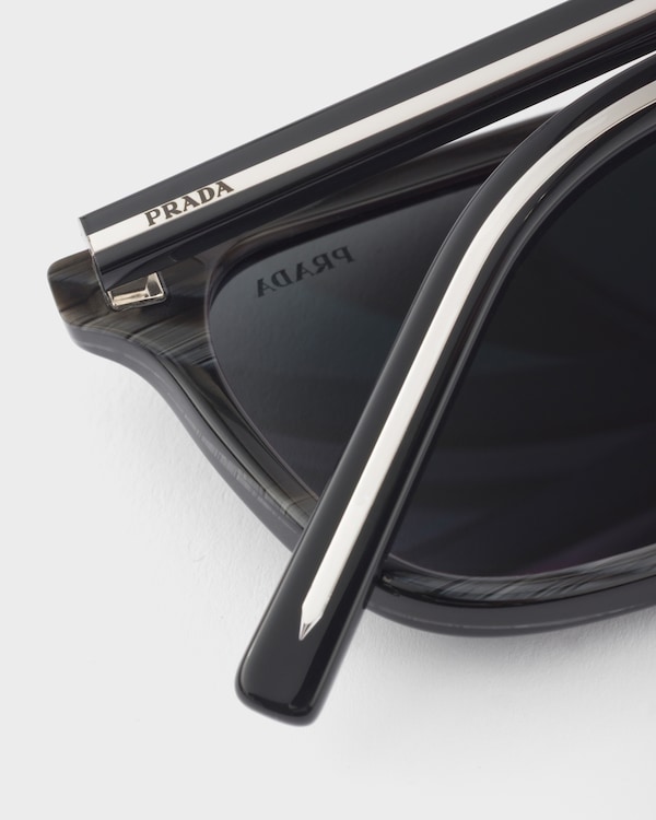 Prada sunglasses with the iconic metal plaque - Slate Lenses Prada sunglasses with the iconic metal plaque - Slate Lenses