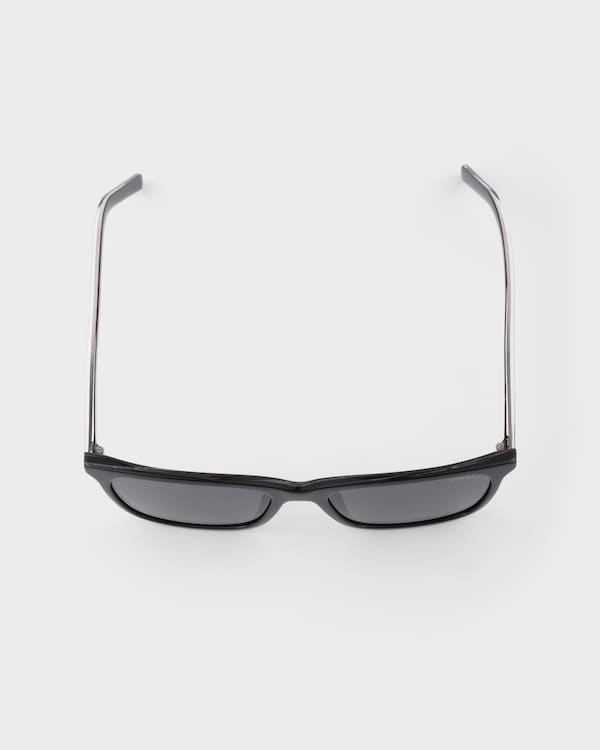 Prada sunglasses with the iconic metal plaque - Slate Lenses Prada sunglasses with the iconic metal plaque - Slate Lenses